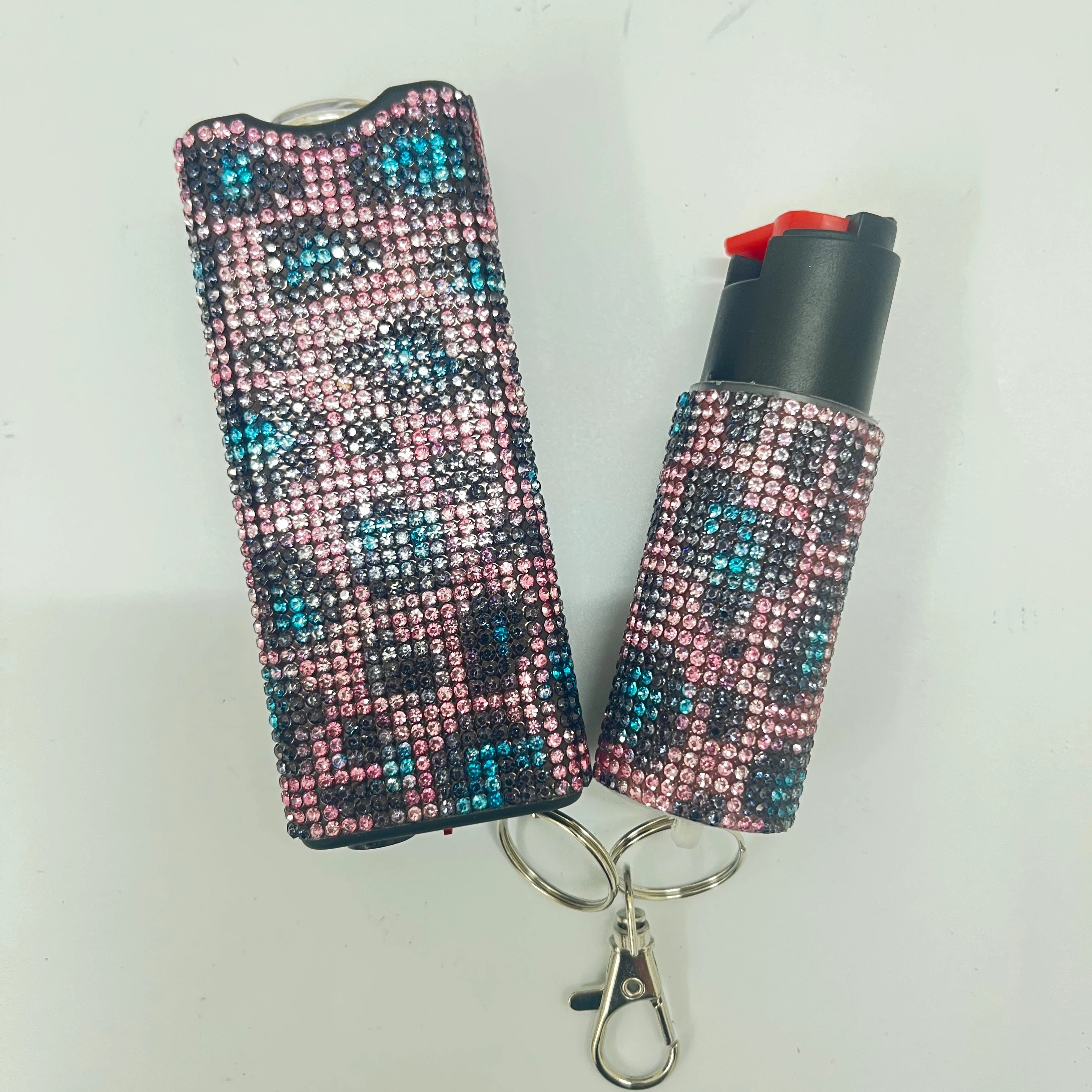 Self-defense multi-functional flashlight + spray keychain set for women.