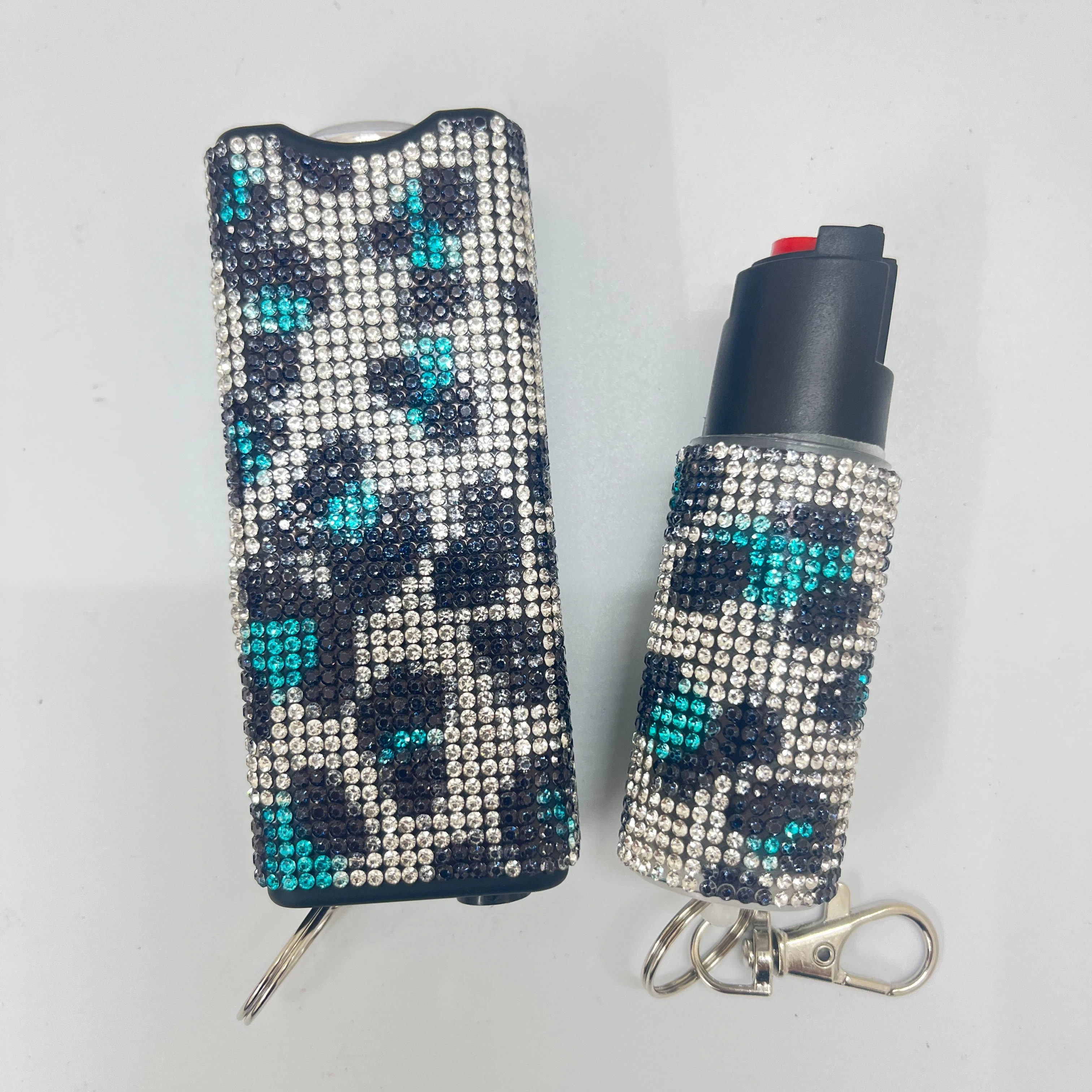 Self-defense multi-functional flashlight + spray keychain set for women.
