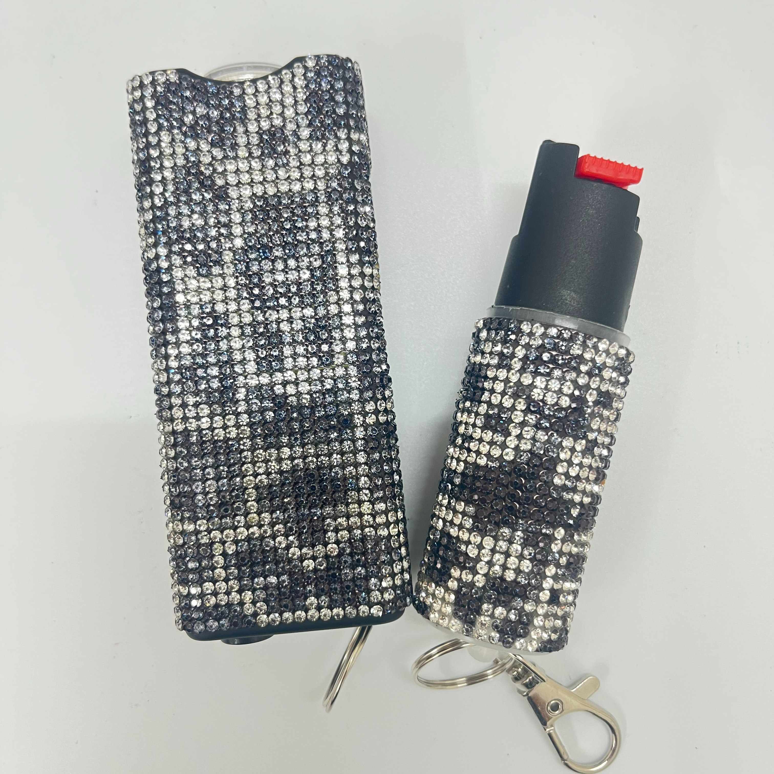 Self-defense multi-functional flashlight + spray keychain set for women.