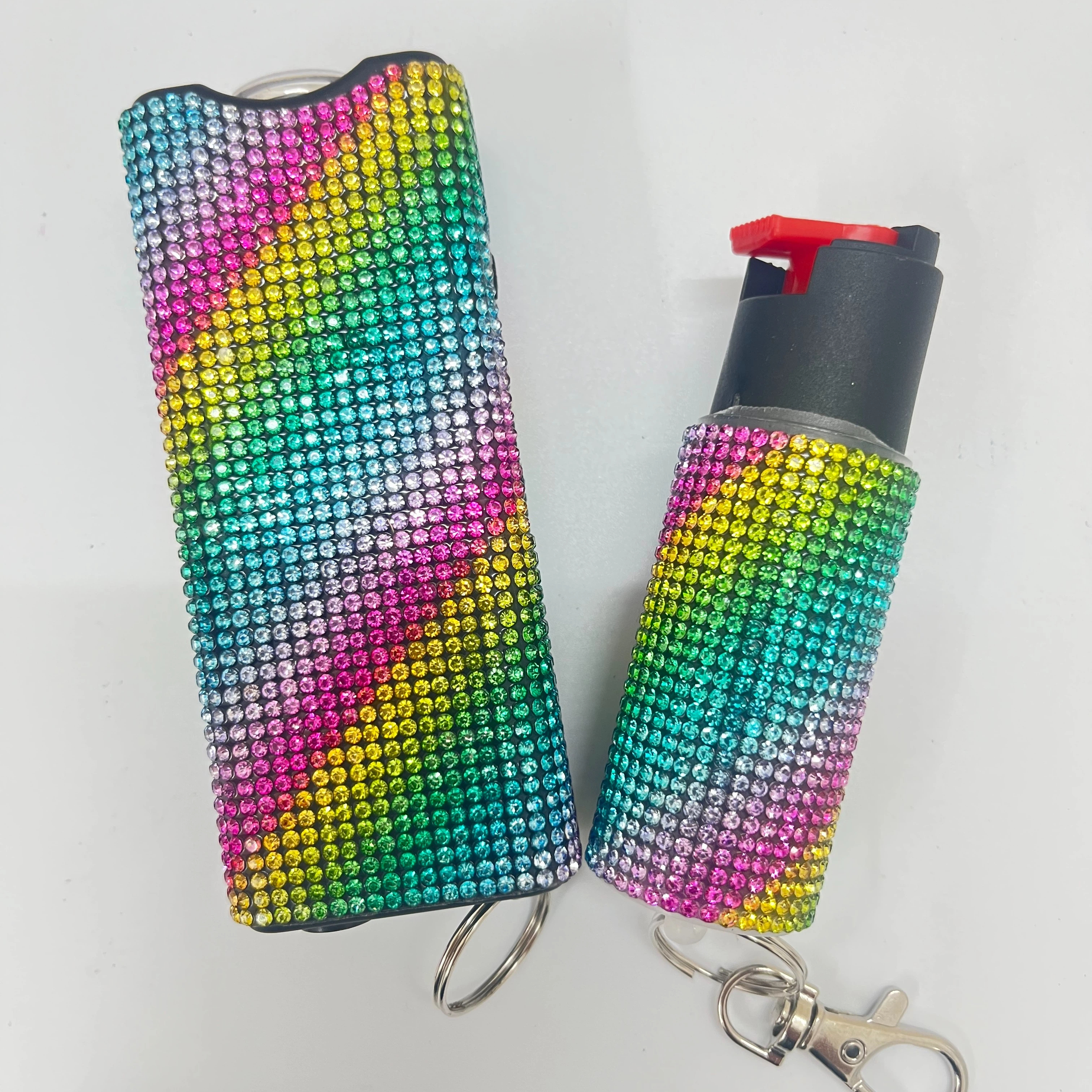 Self-defense multi-functional flashlight + spray keychain set for women.