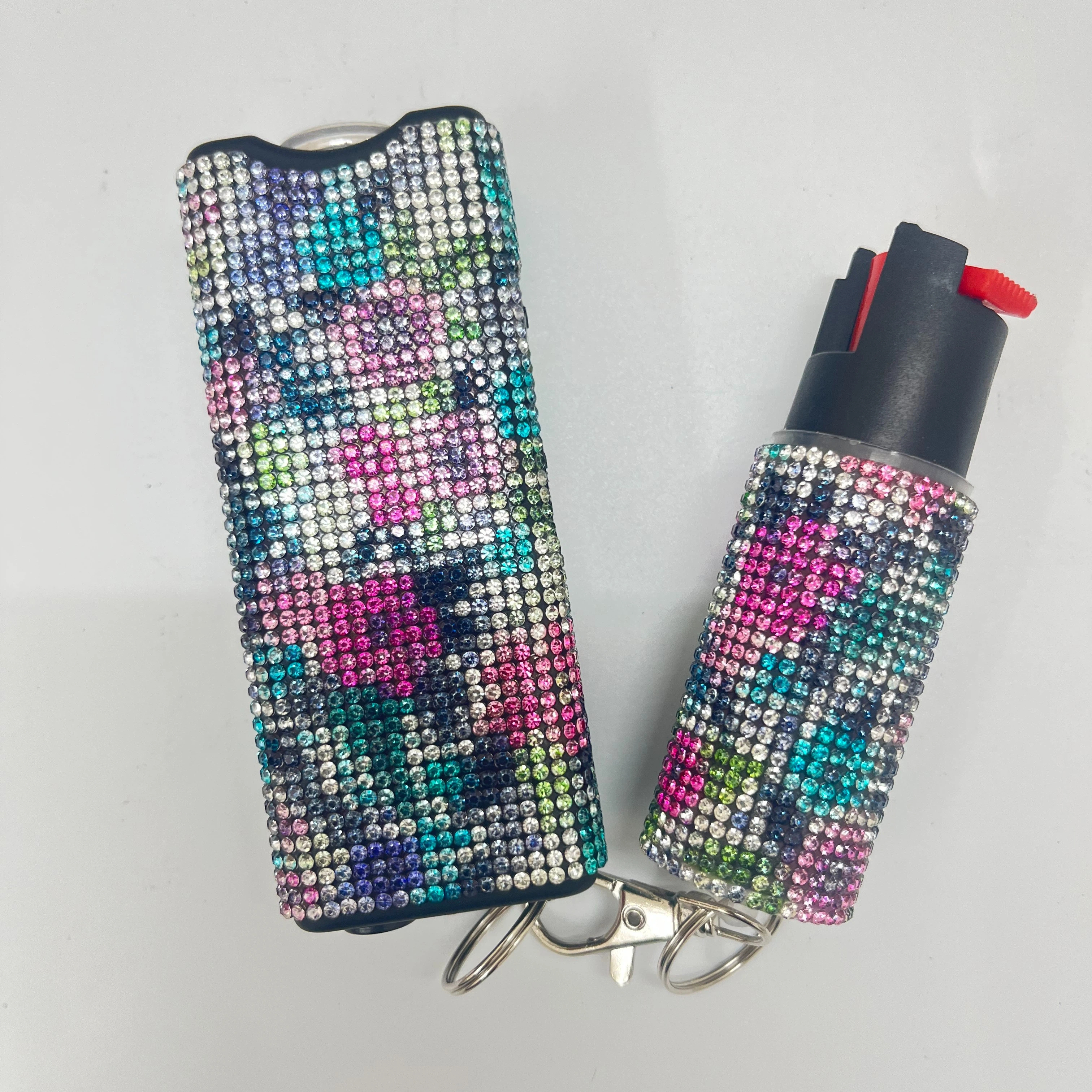 Self-defense multi-functional flashlight + spray keychain set for women.