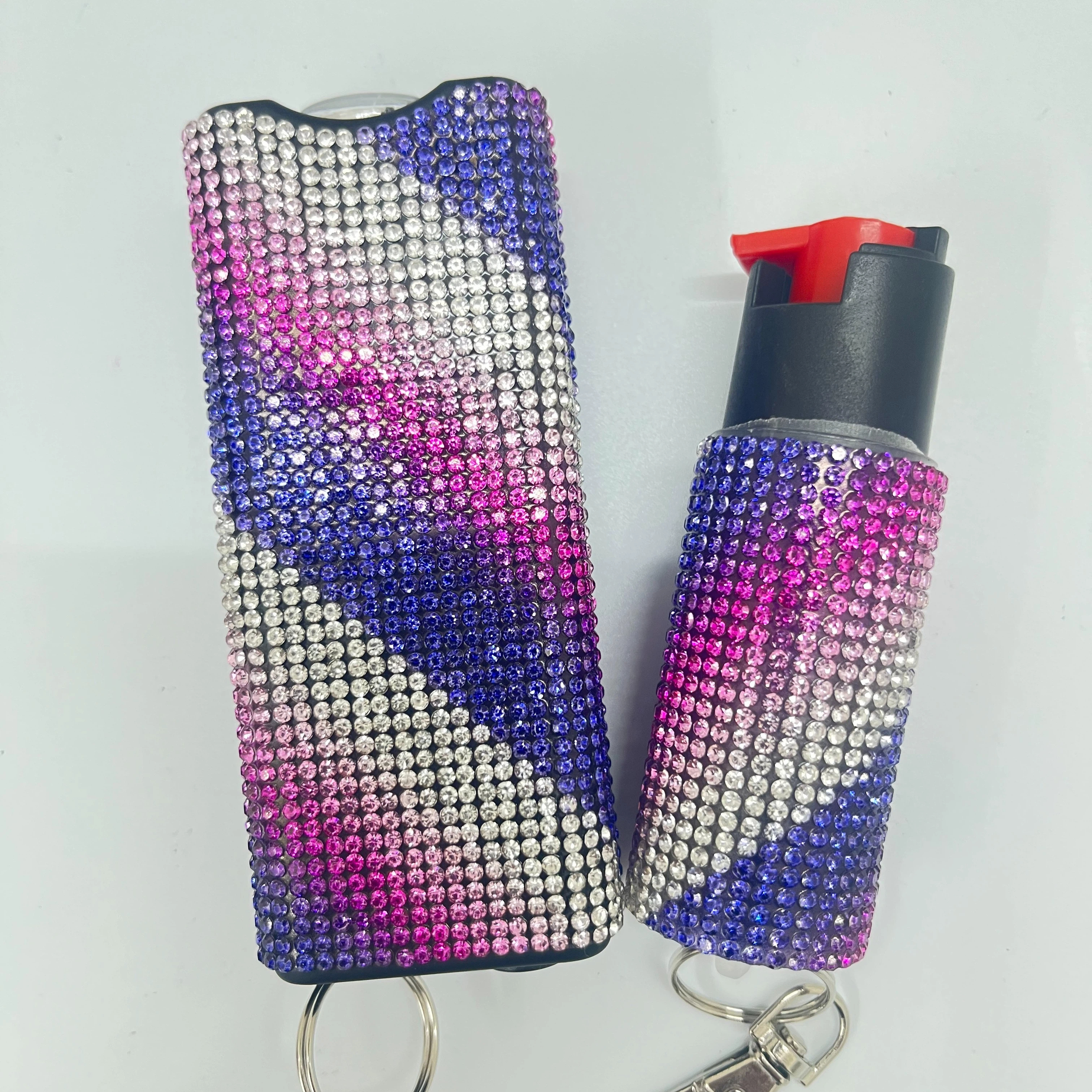 Self-defense multi-functional flashlight + spray keychain set for women.