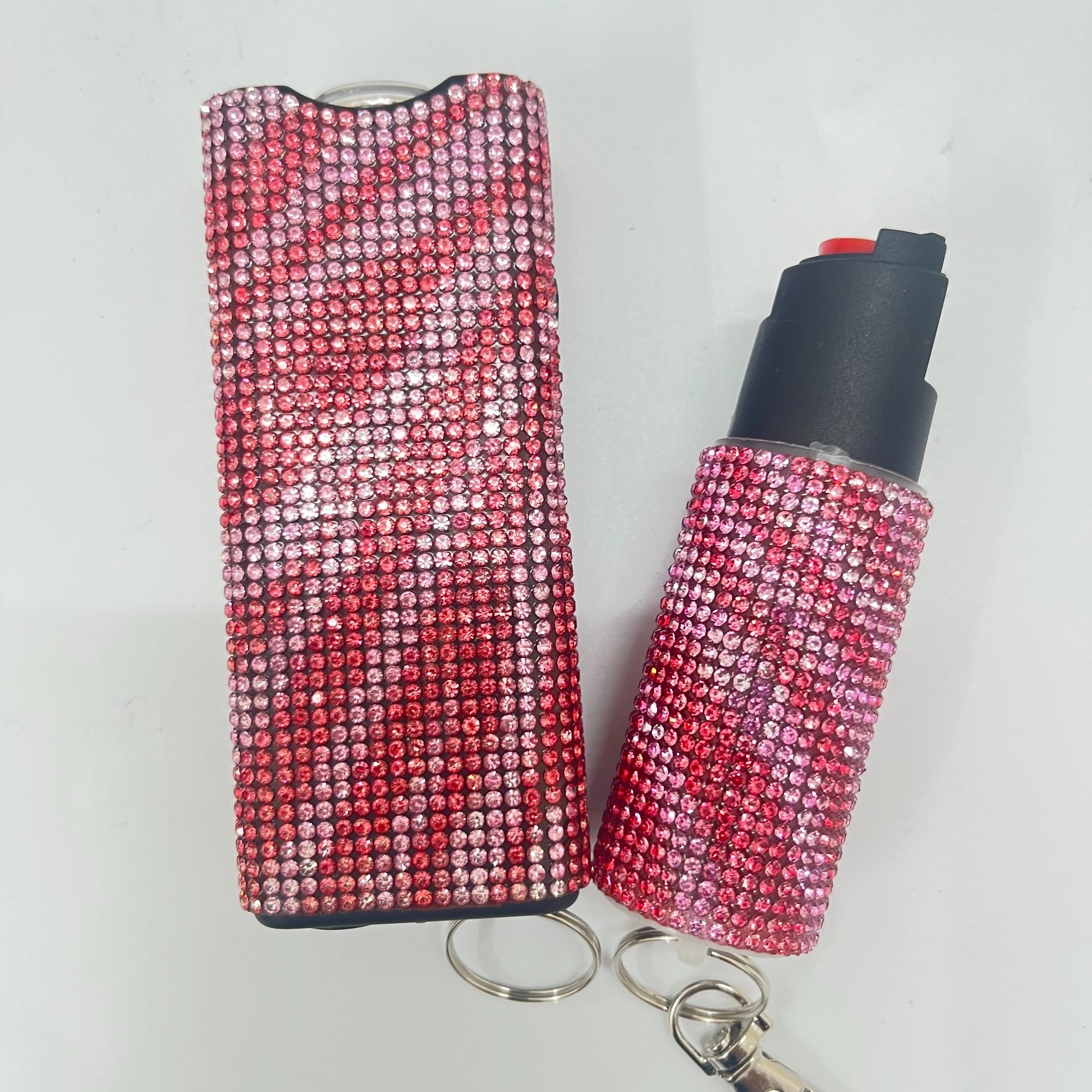 Self-defense multi-functional flashlight + spray keychain set for women.