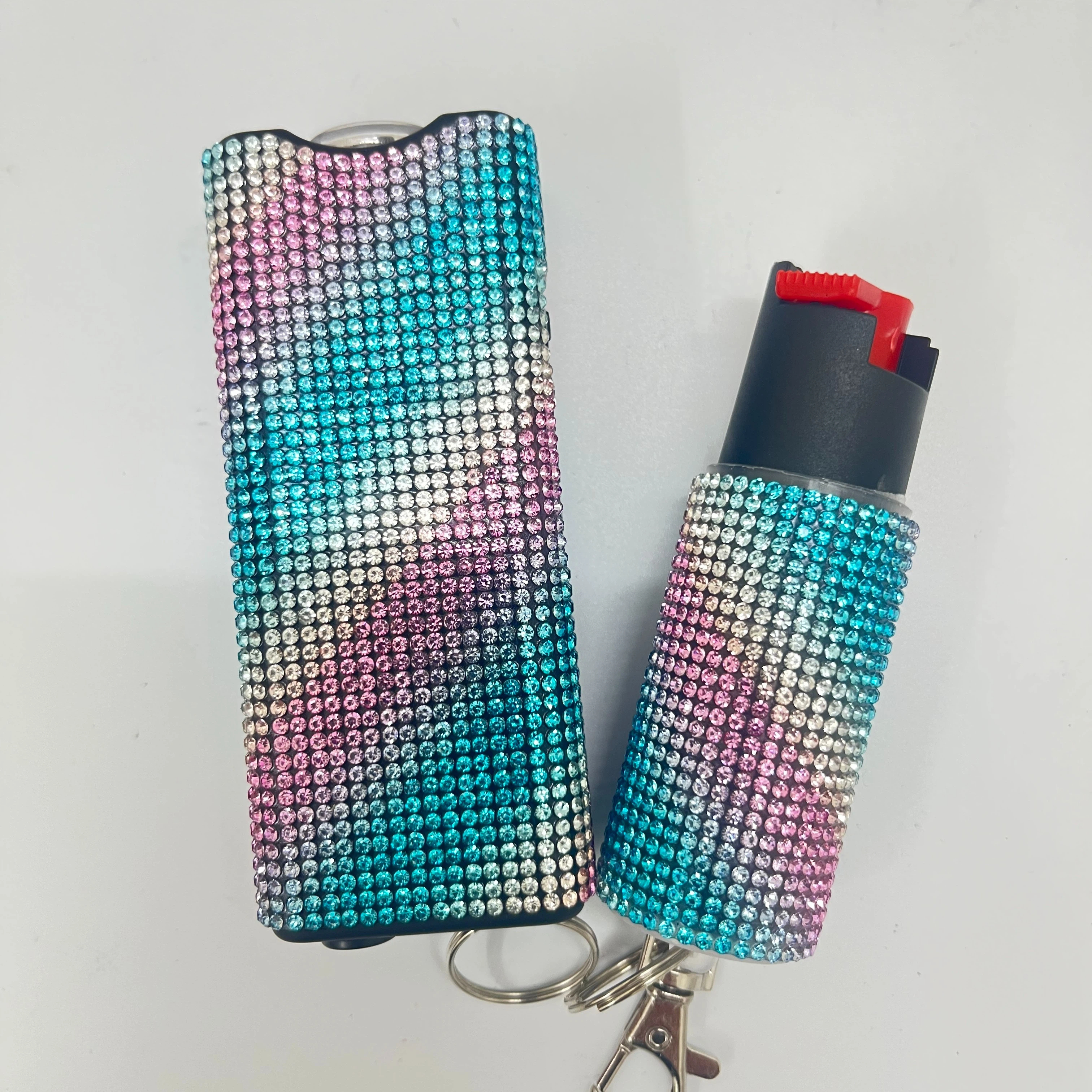 Self-defense multi-functional flashlight + spray keychain set for women.