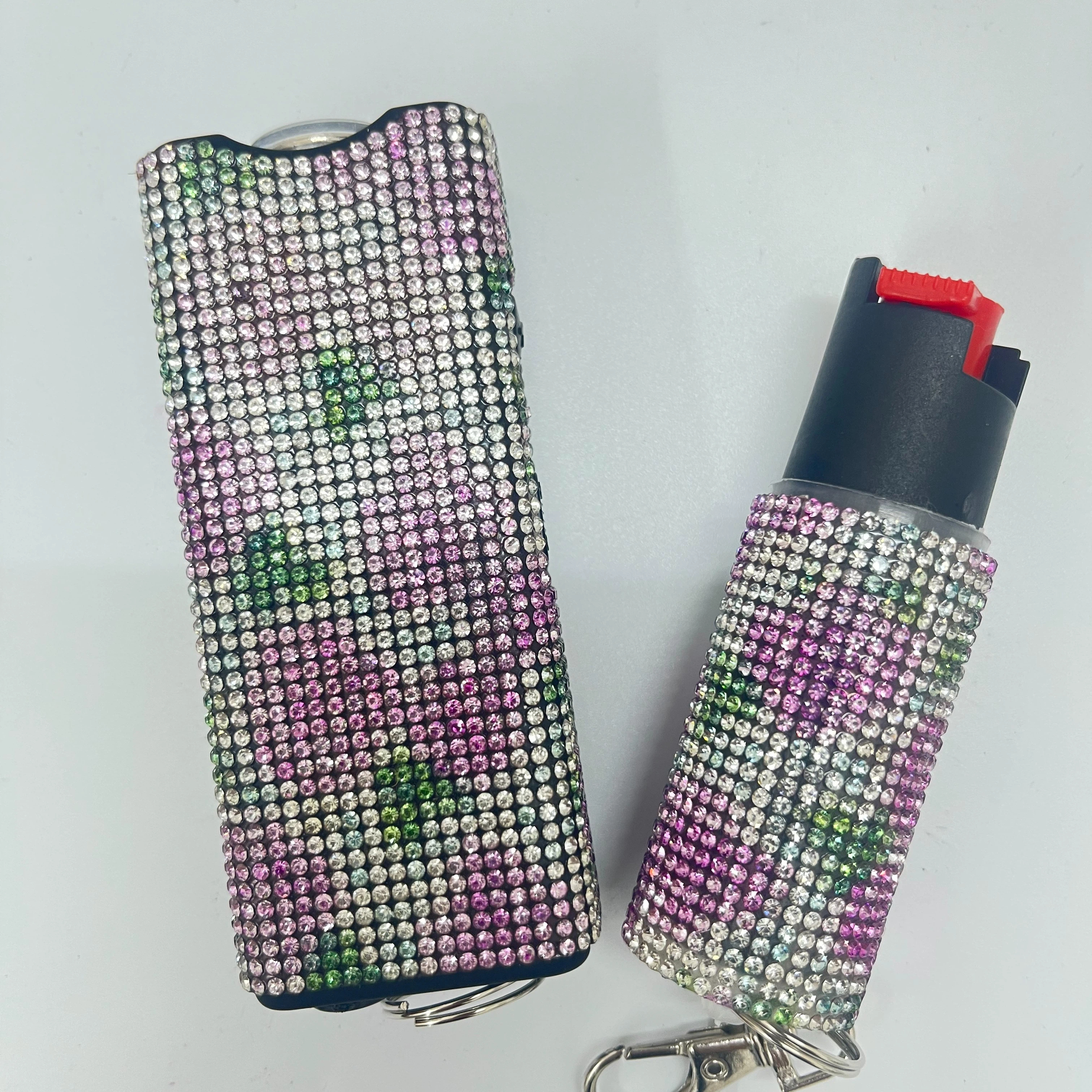 Self-defense multi-functional flashlight + spray keychain set for women.