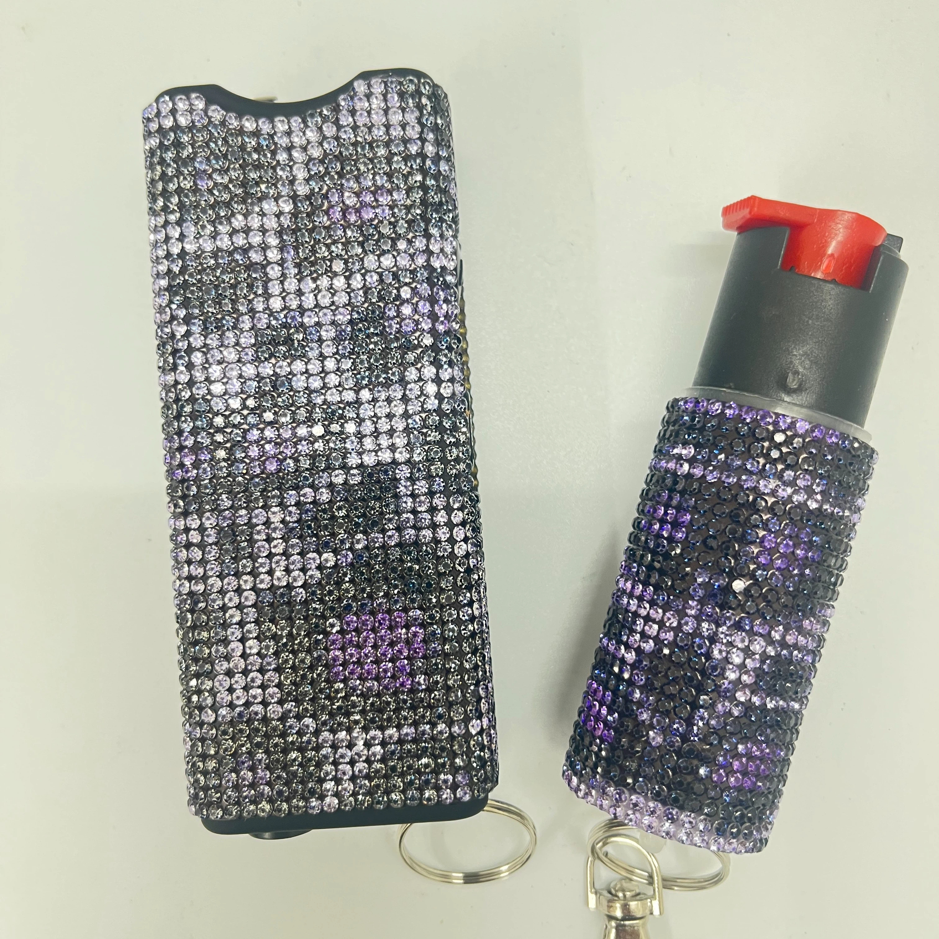 Self-defense multi-functional flashlight + spray keychain set for women.
