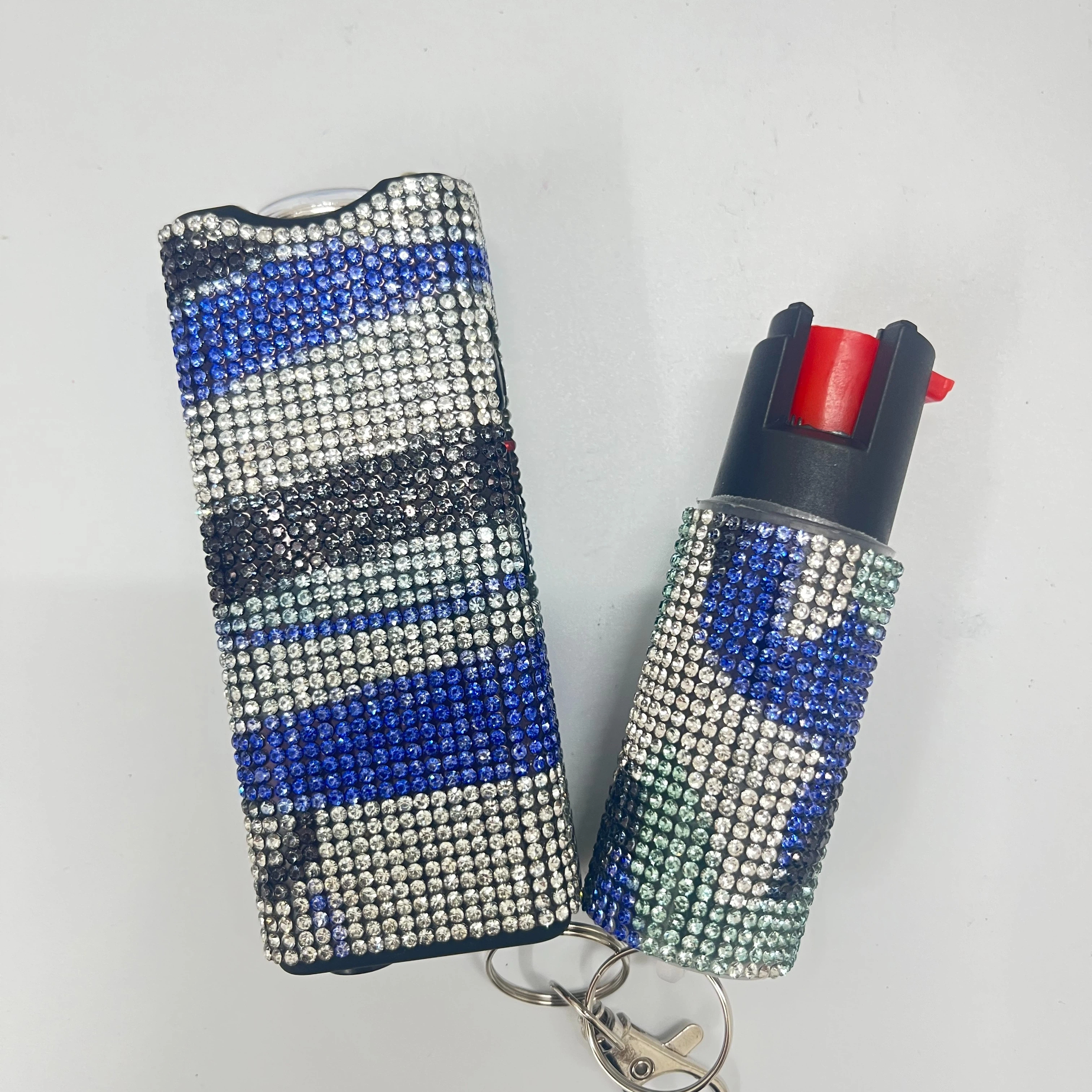 Self-defense multi-functional flashlight + spray keychain set for women.