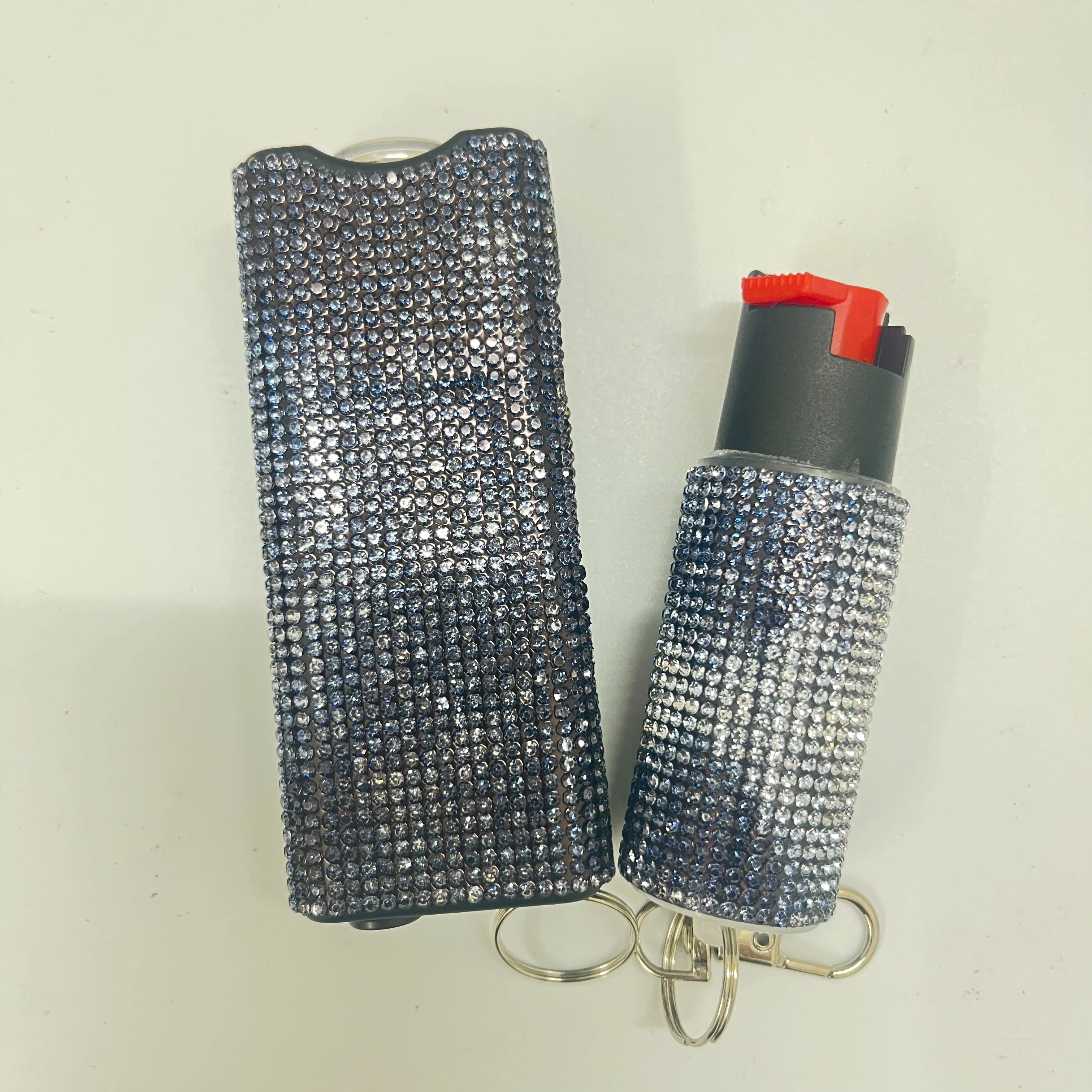 Self-defense multi-functional flashlight + spray keychain set for women.