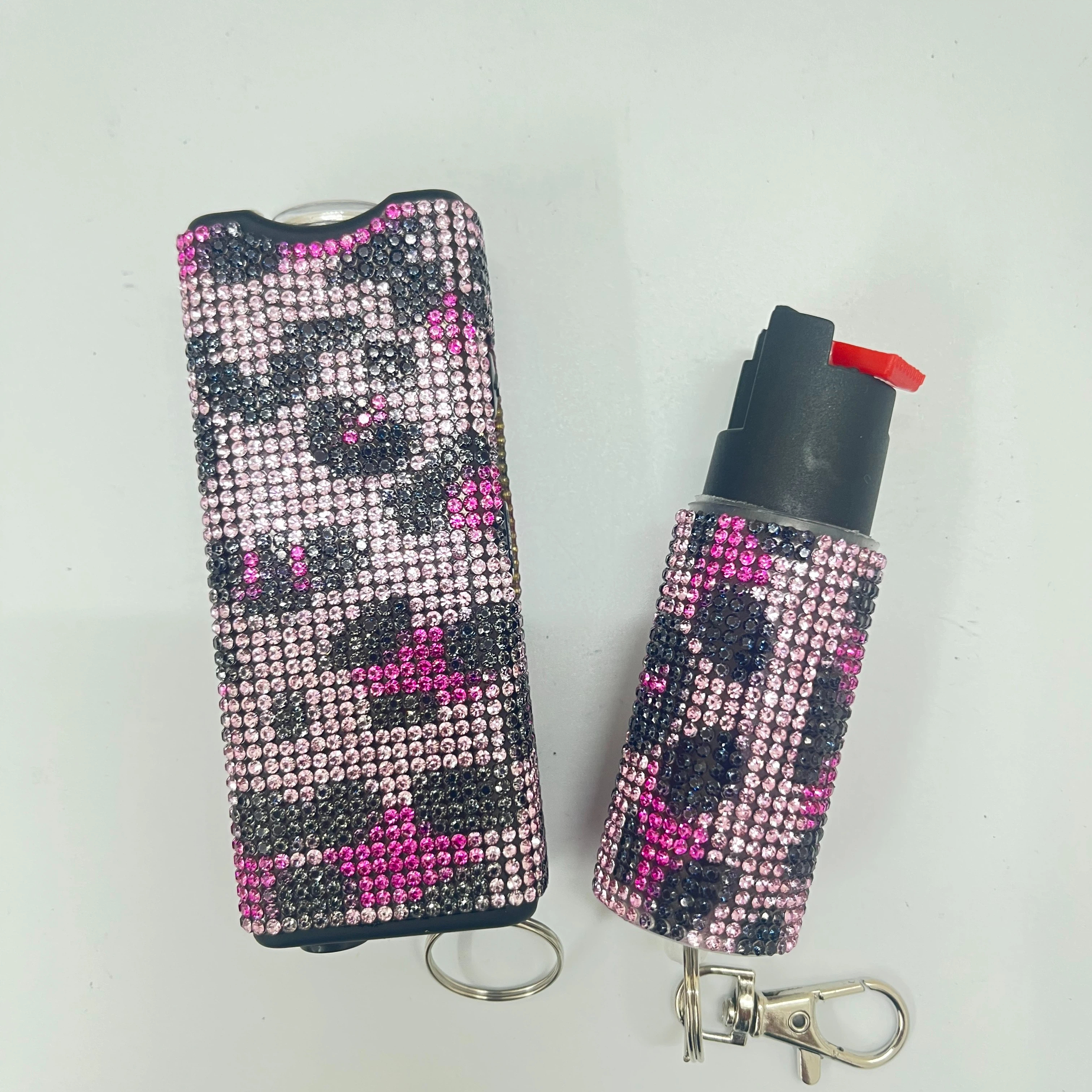 Self-defense multi-functional flashlight + spray keychain set for women.
