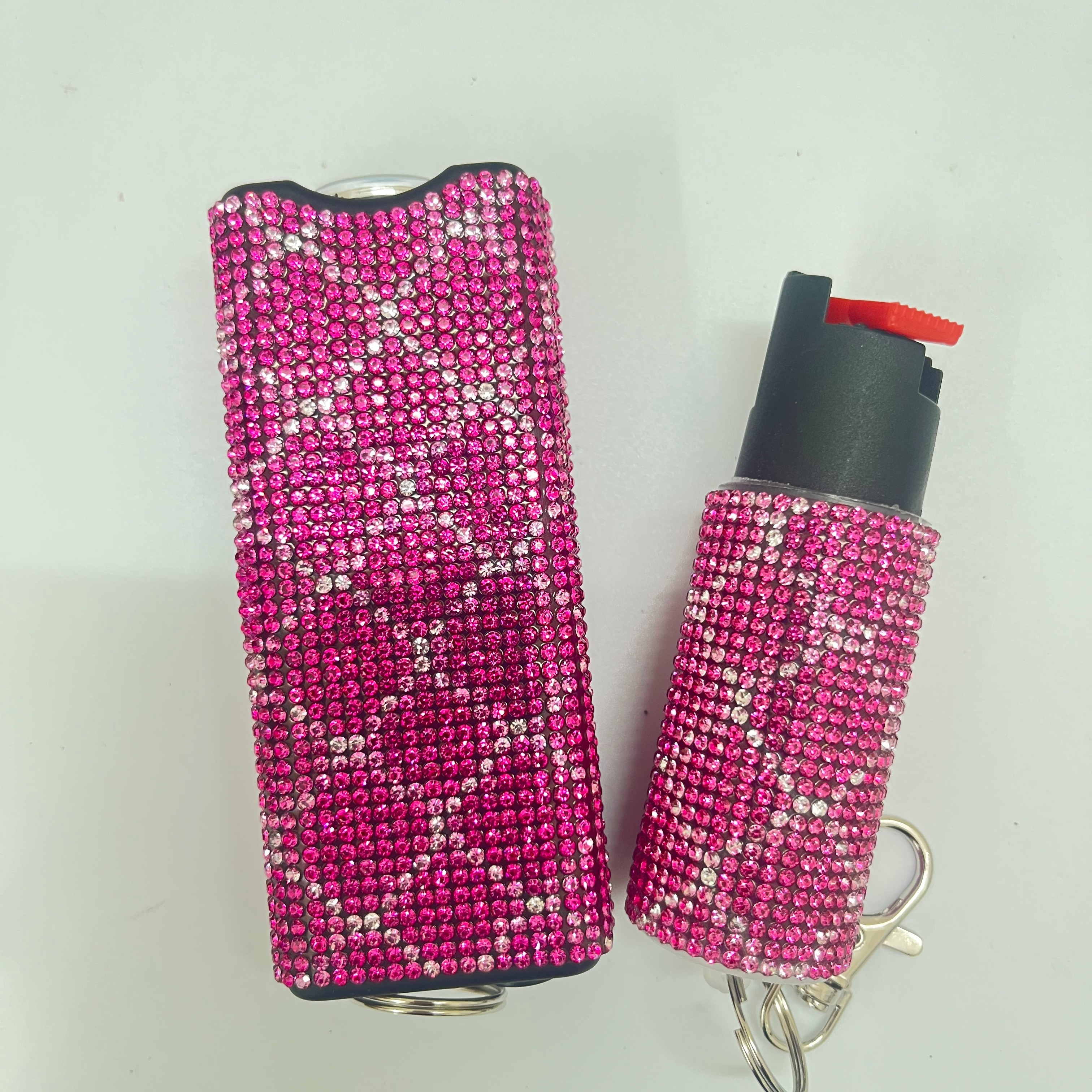 Self-defense multi-functional flashlight + spray keychain set for women.