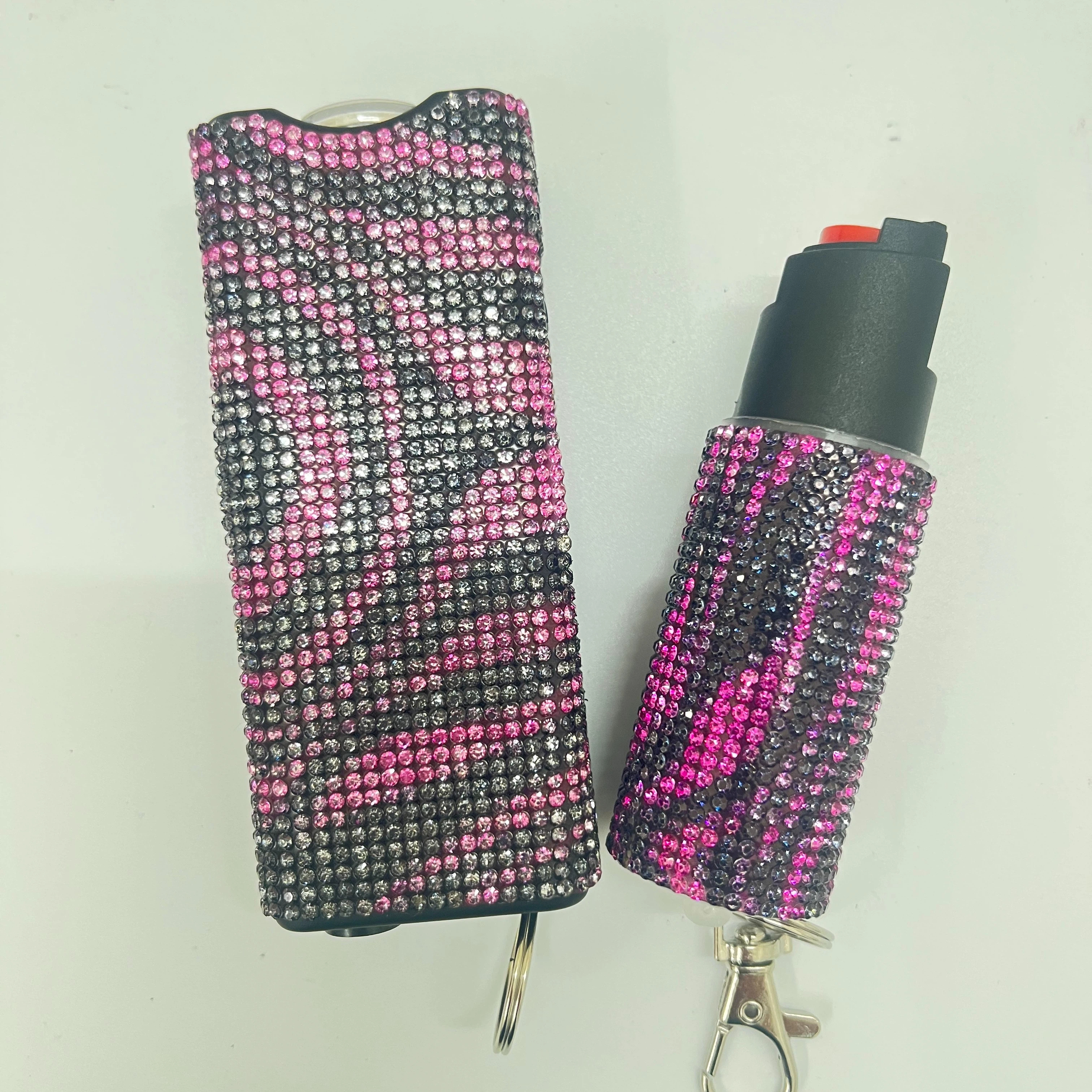 Self-defense multi-functional flashlight + spray keychain set for women.