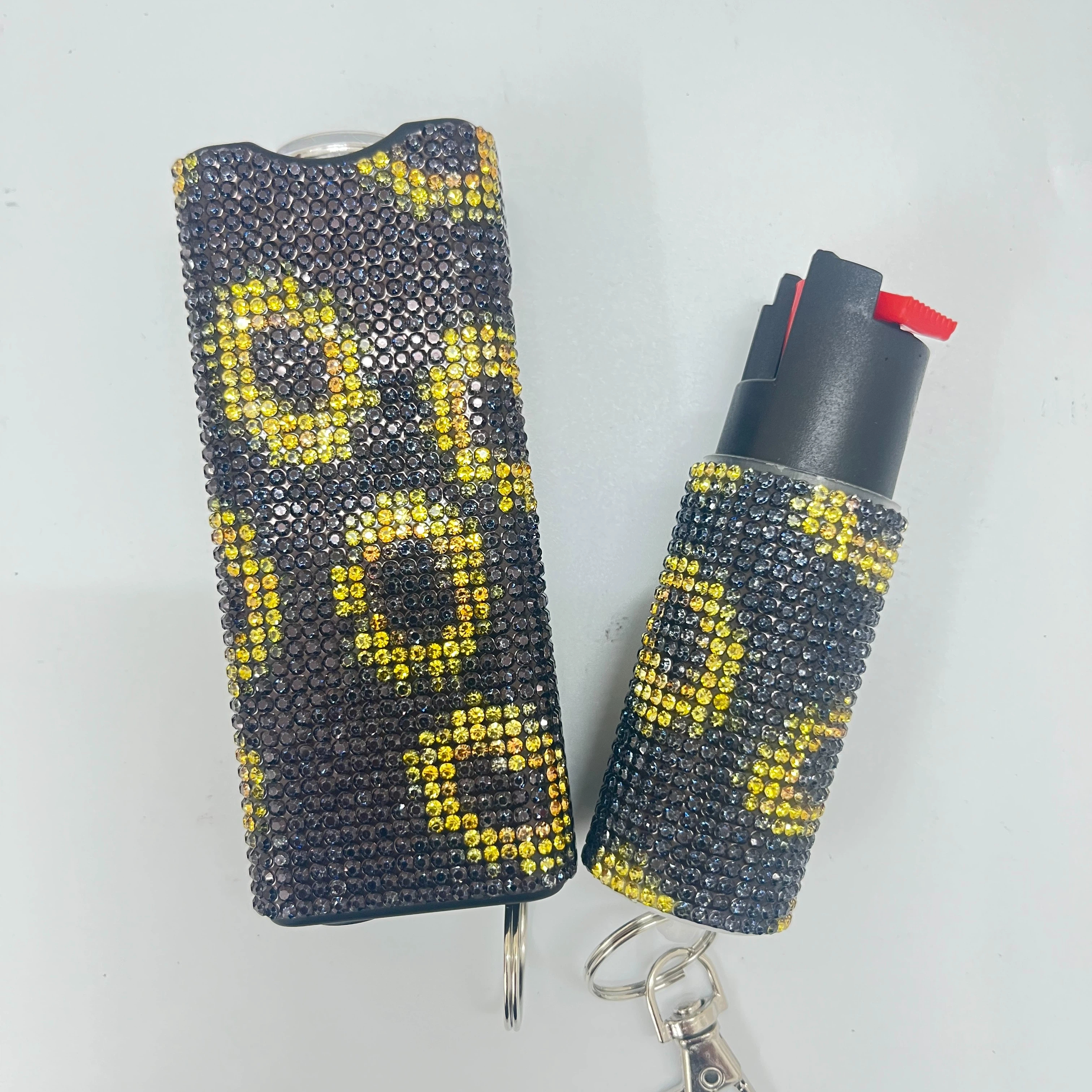 Self-defense multi-functional flashlight + spray keychain set for women.