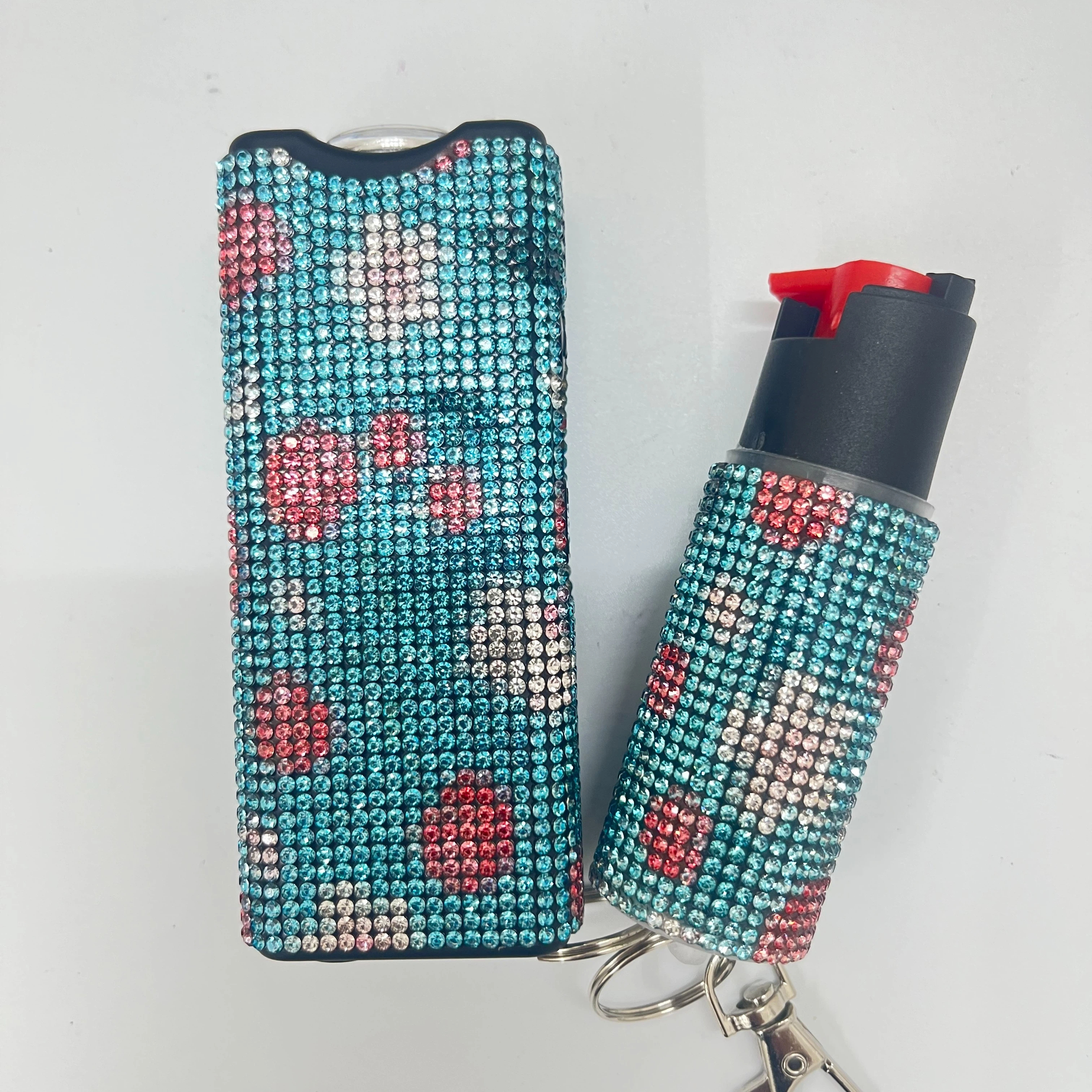 Self-defense multi-functional flashlight + spray keychain set for women.