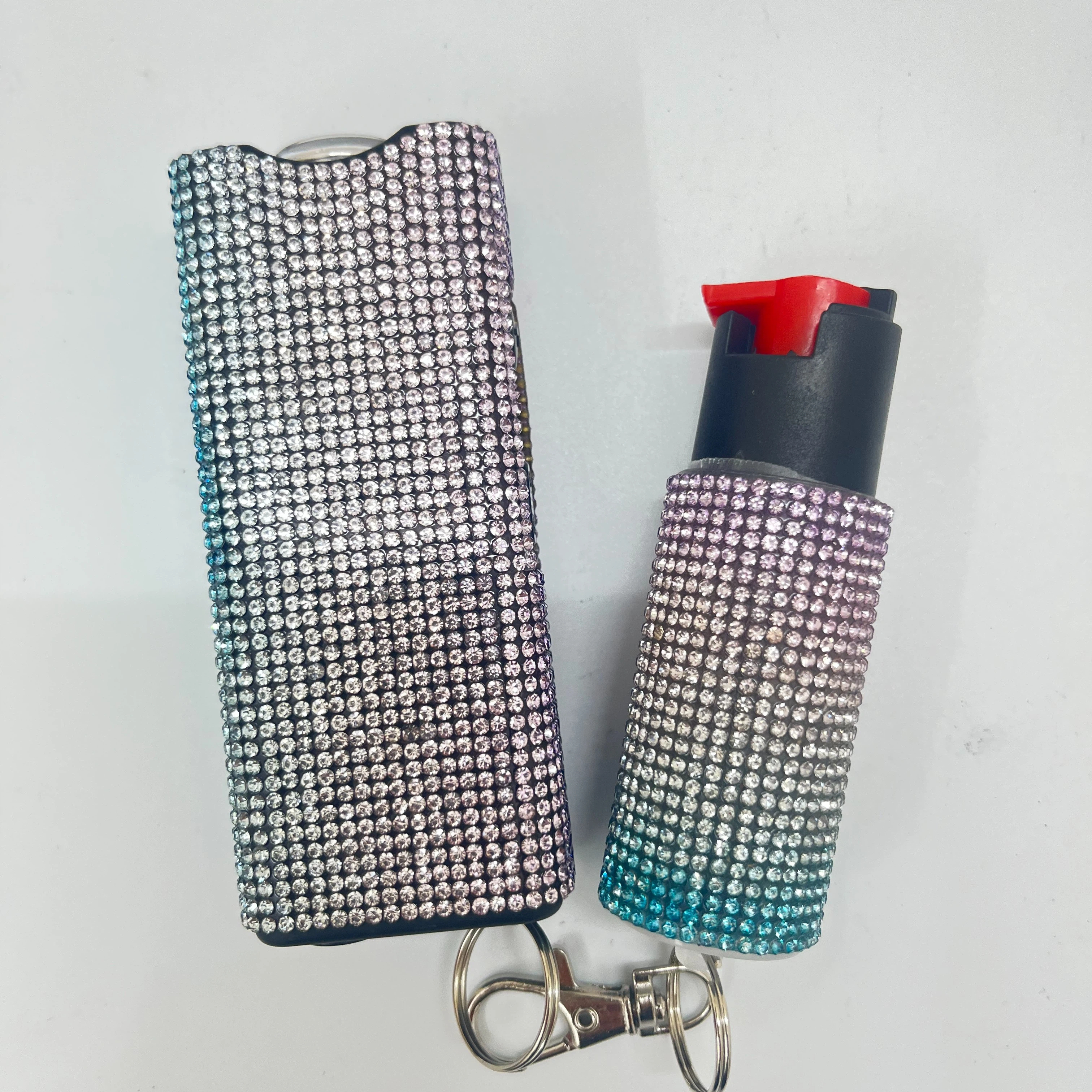 Self-defense multi-functional flashlight + spray keychain set for women.