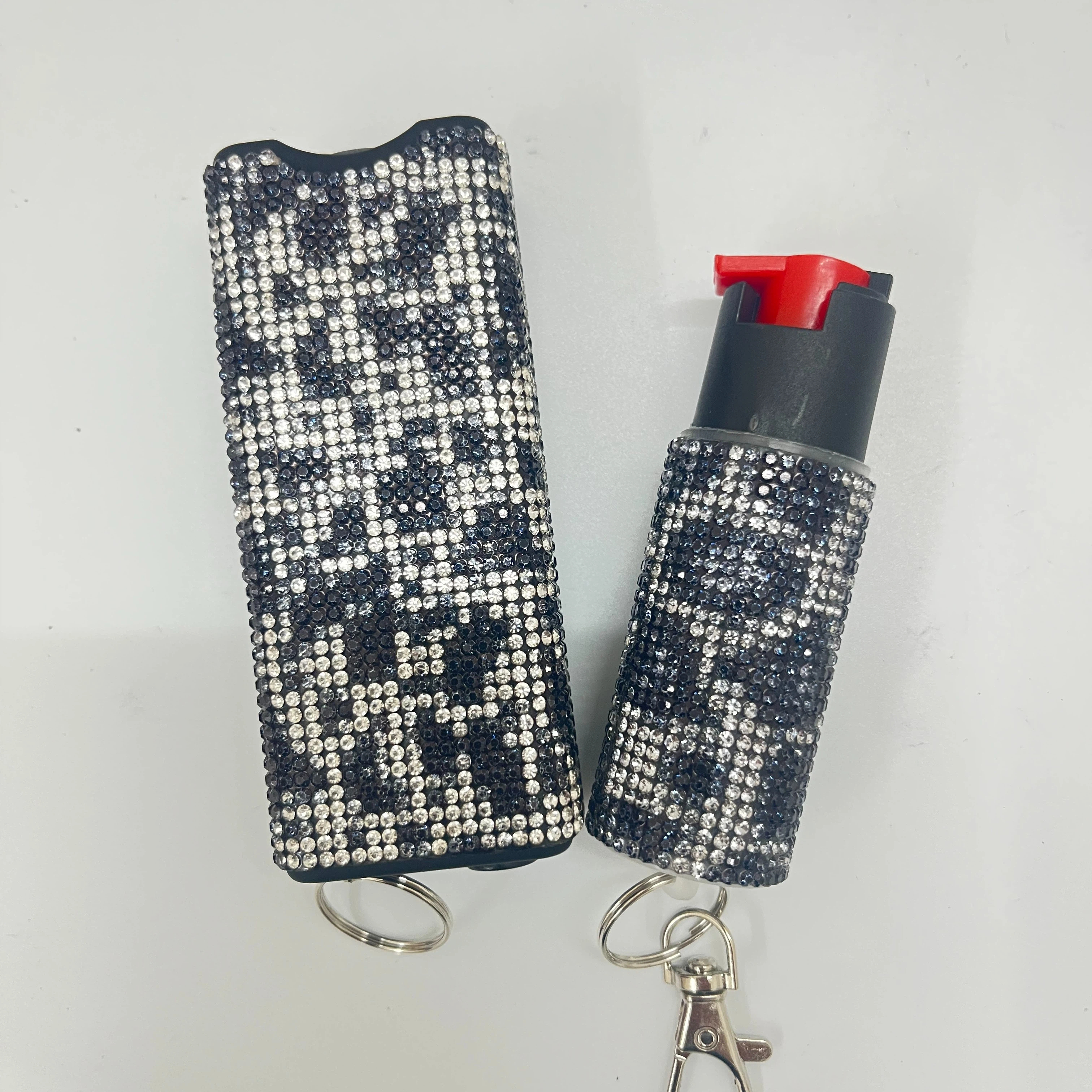 Self-defense multi-functional flashlight + spray keychain set for women.