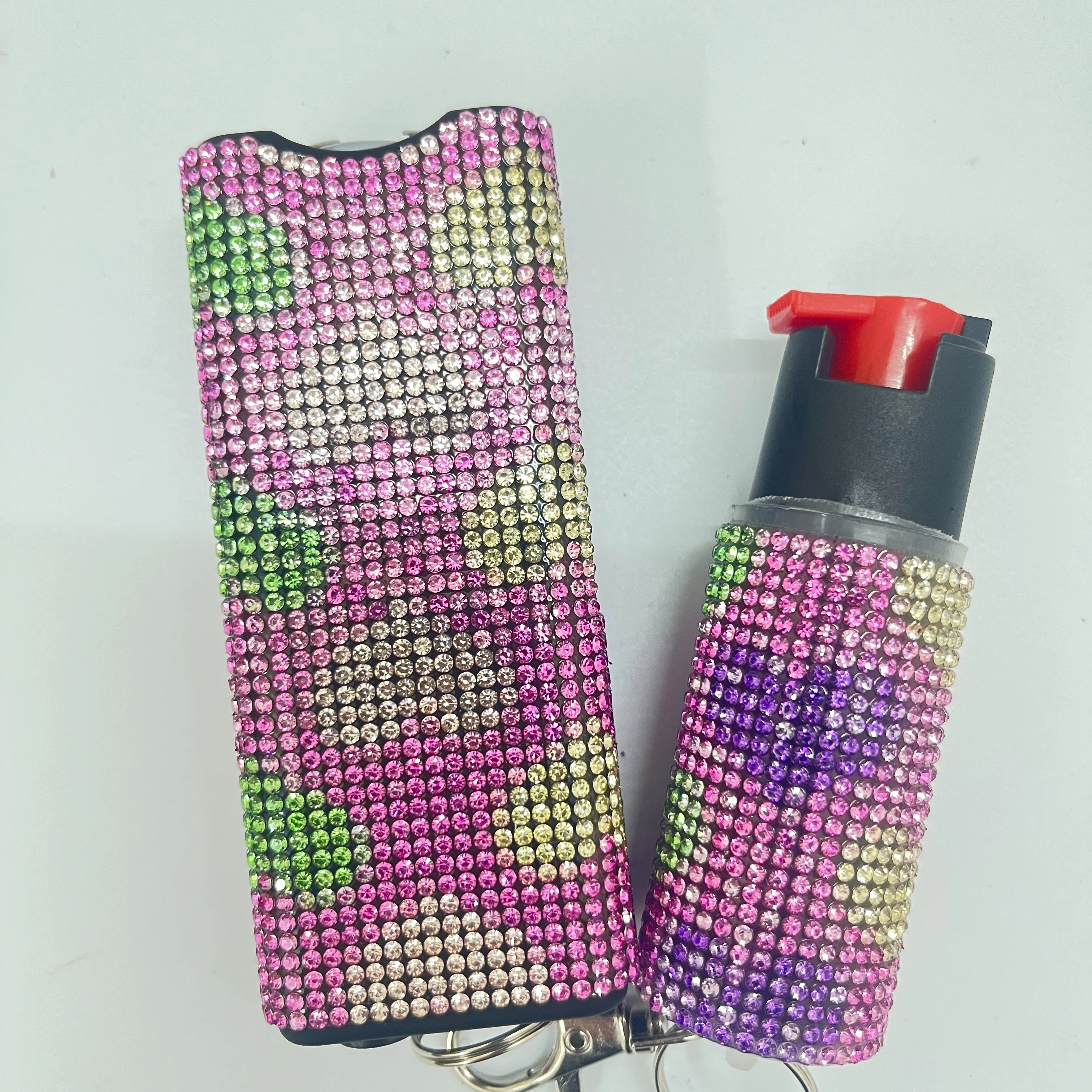 Self-defense multi-functional flashlight + spray keychain set for women.