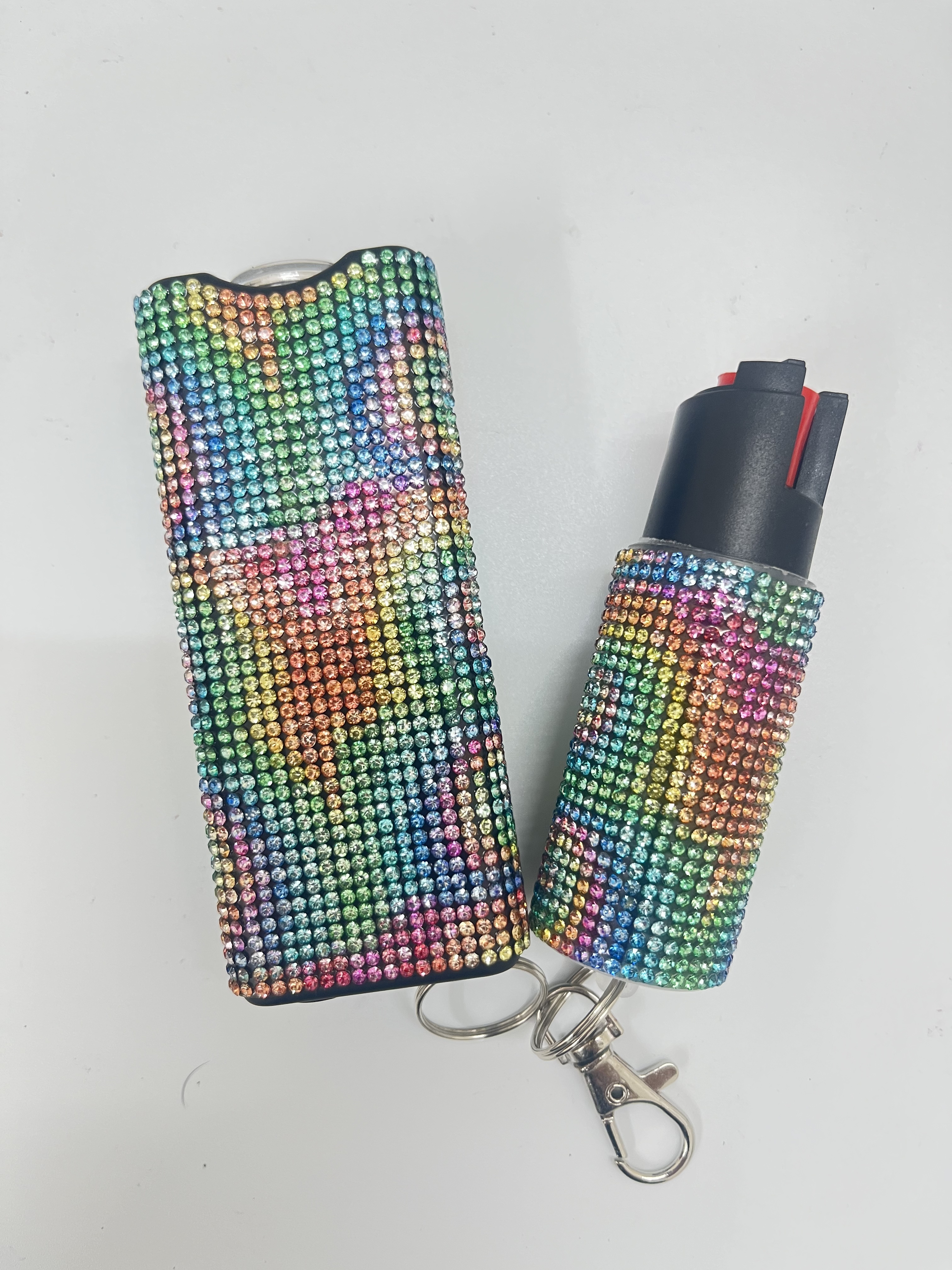 Self-defense multi-functional flashlight + spray keychain set for women.