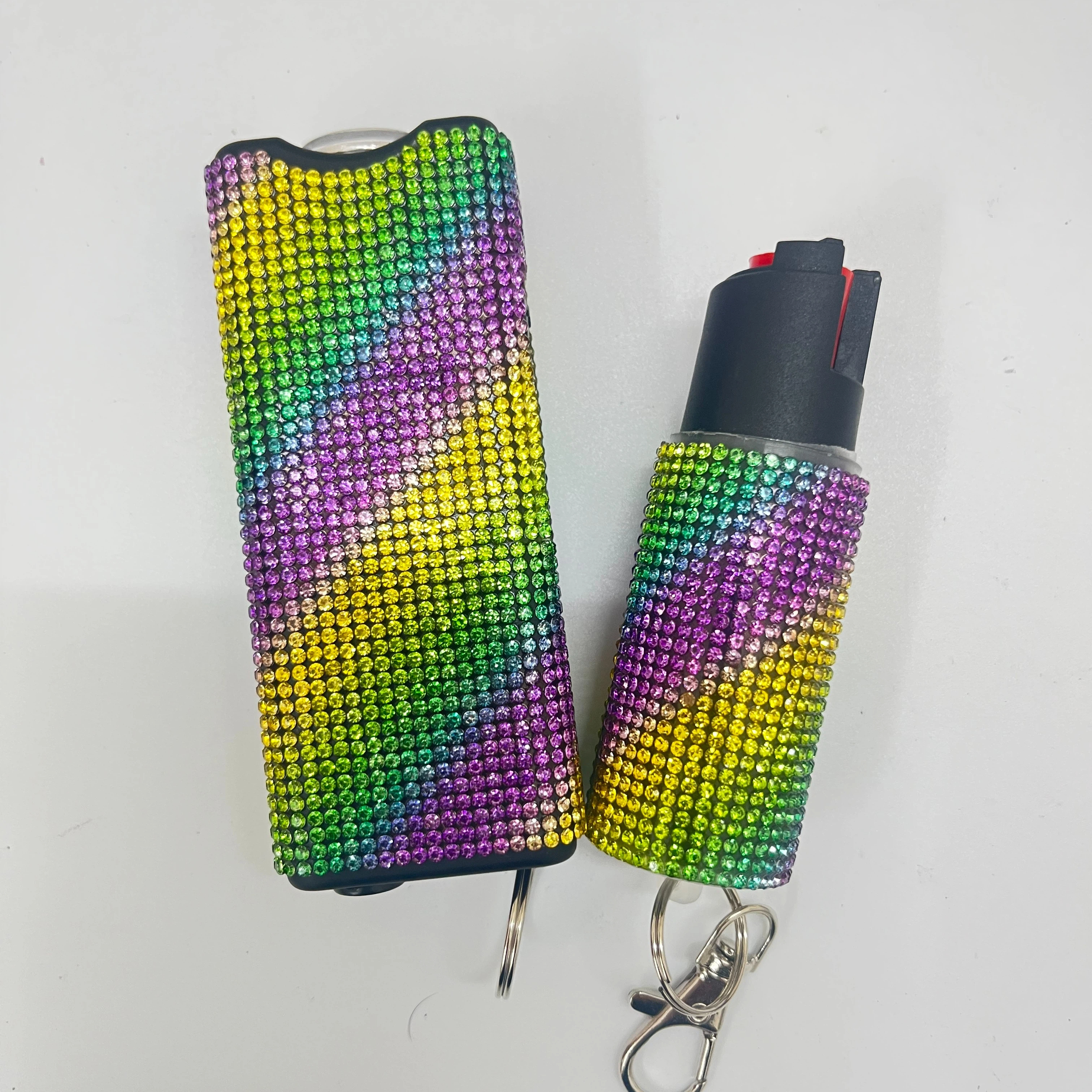 Self-defense multi-functional flashlight + spray keychain set for women.