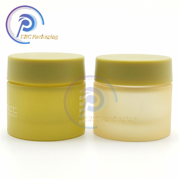 2oz gold child resistant glass jar with black lid