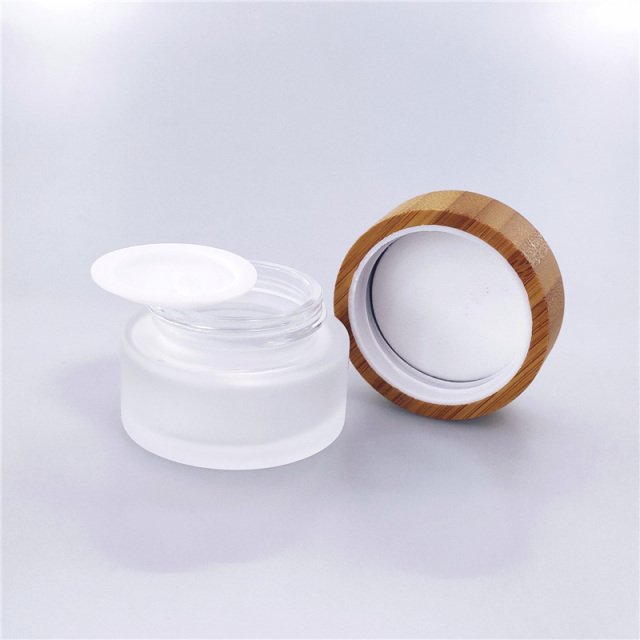 Cosmetic glass cream jar with bamboo lid CBD oil custom color