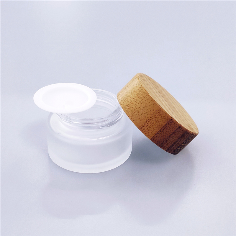 Cosmetic glass cream jar with bamboo lid CBD oil custom color
