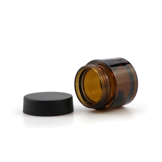 Wholesale amber glass jars airtight container recyclable glass jar child resistant packaging with black lid