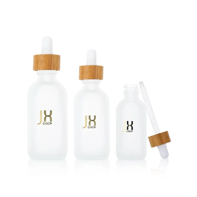 Hot sale luxury customize 30ml frosted cosmetic bottle droppe glass bottle for essential oil with bamboo cap