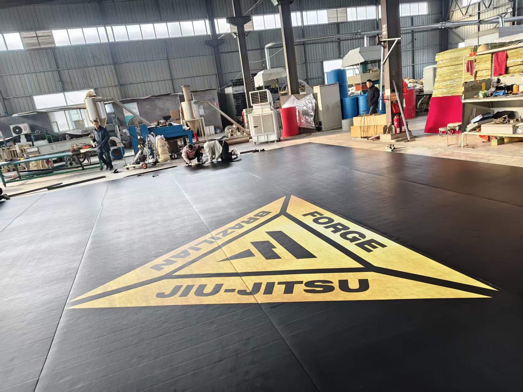 Custom gym logo printed on 5cm black roll-out grappling mat for Forge BJJ