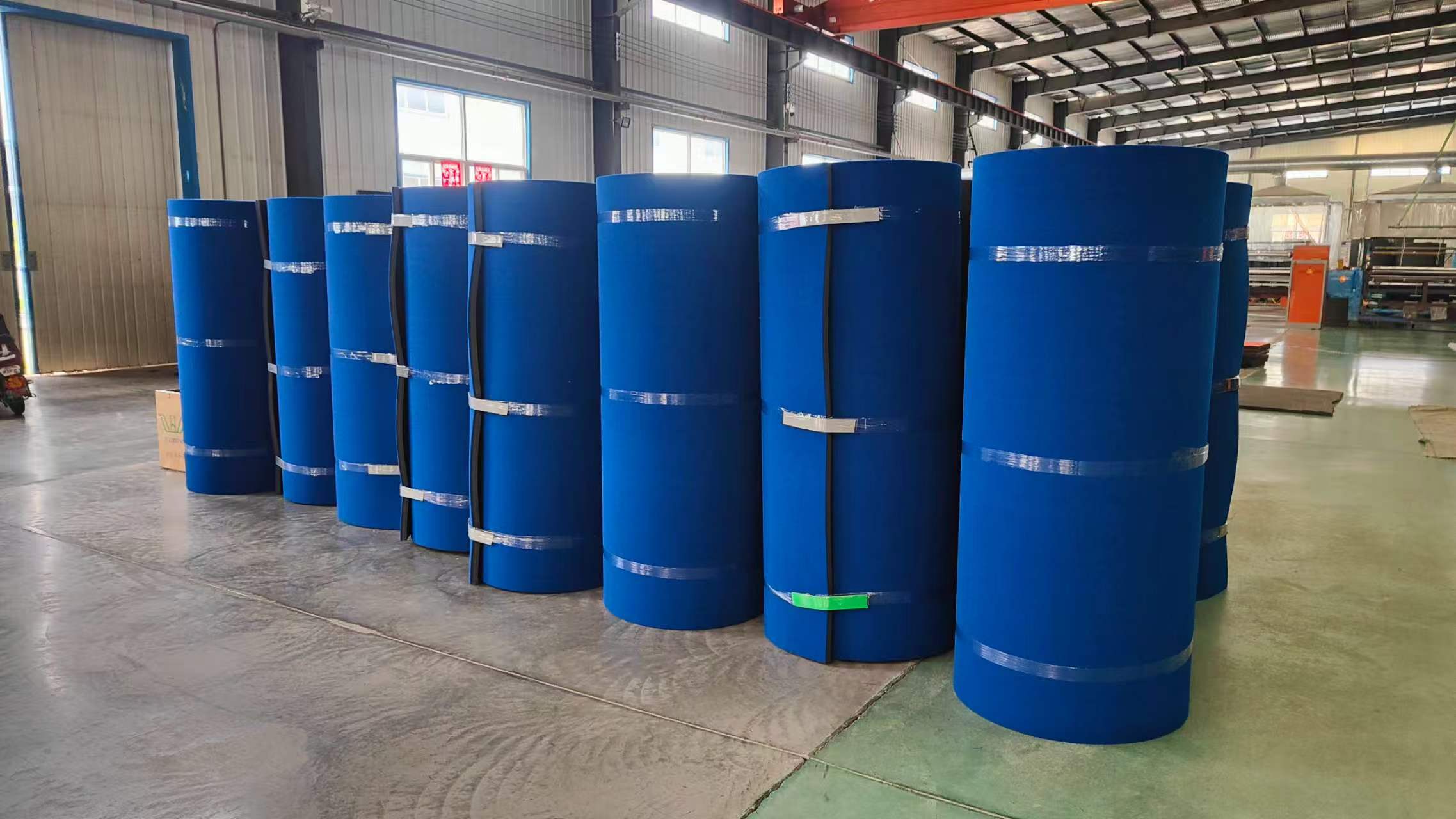 Carpet bonded foam rolls in warehouse