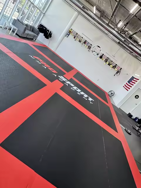 ProSport MMA Academy red and black mats installation in progress