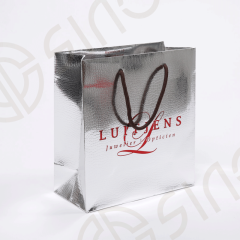 Luxury paper bag used silver foil paper with pressed texture