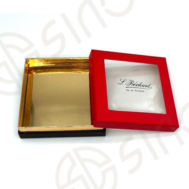 Rigid box with window lid