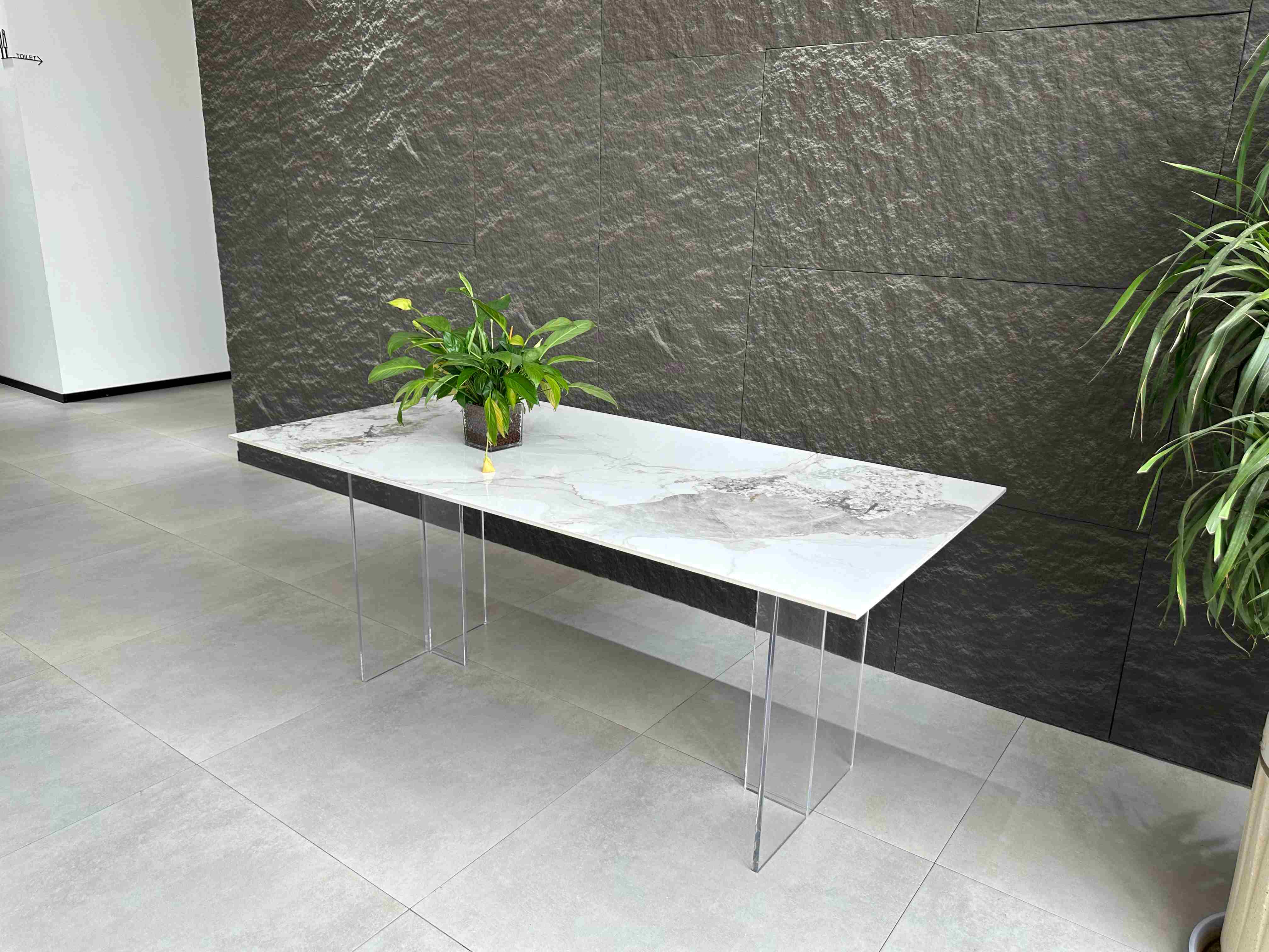 Newly Modern rectangular dining table with ceramic top and Acrylic legs