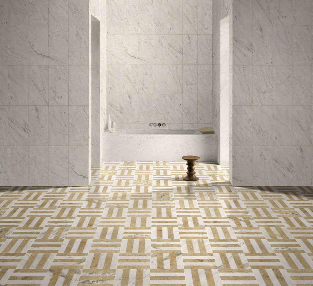 Luxury interior design showcasing a mixed marble application: The floor features polished 12x12 Snow Mountain White and Hyatt Gold waterjet tiles in a geometric pattern, complemented by large format 12x24 Snow Mountain White textured finish marble tiles on the accent wall.