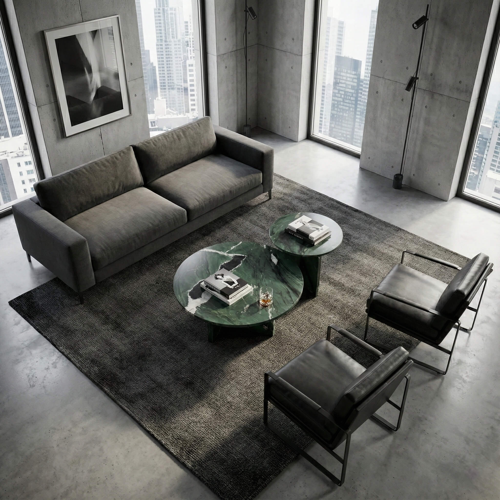 Industrial loft apartment aesthetic featuring green marble tables that add a touch of natural luxury to a concrete and urban modern living space.