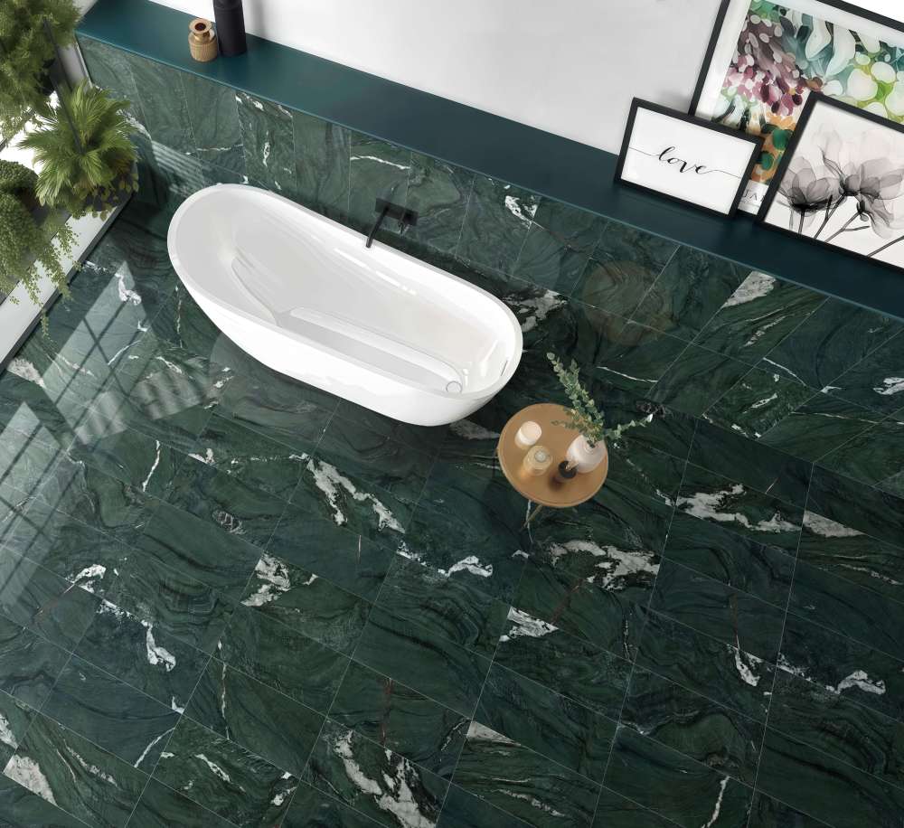 Overhead view of a luxury spa-like bathroom with Diamond Green marble flooring, highlighting the polished stone texture next to a white freestanding tub.