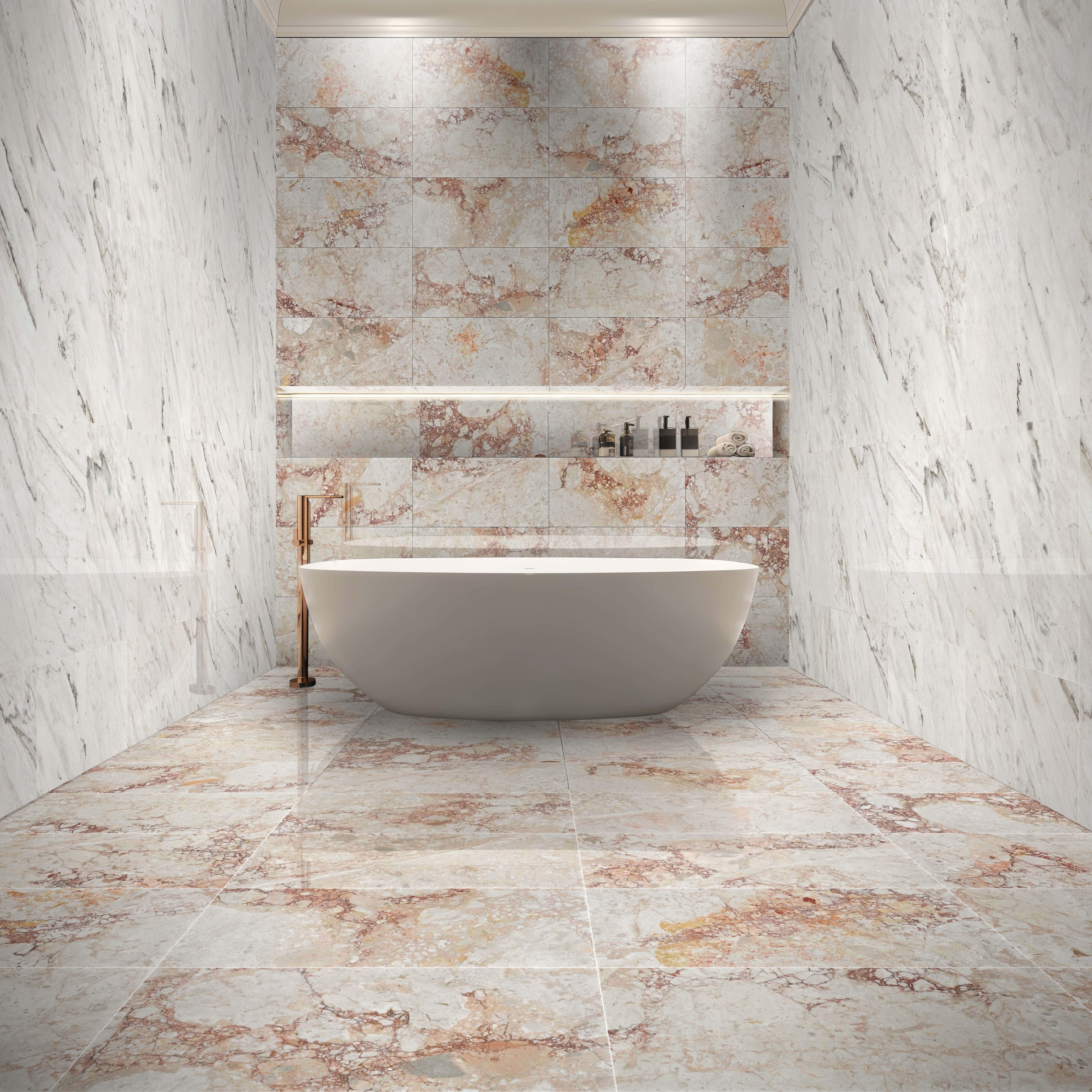 Luxury bathroom design featuring a stylish combination of Diamond Pink marble flooring and Snow Mountain White marble wall tiles, centered with a white freestanding tub.