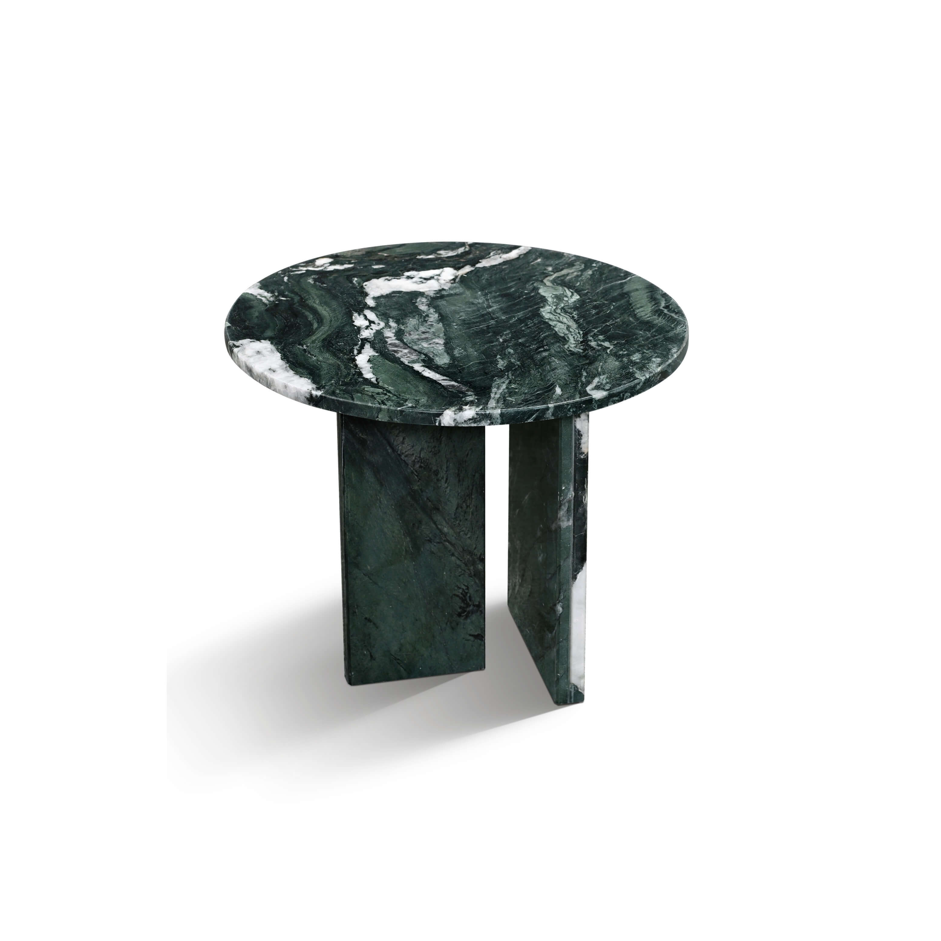 Angled view of a Diamond Green natural marble side table featuring a polished round top and sturdy geometric legs.