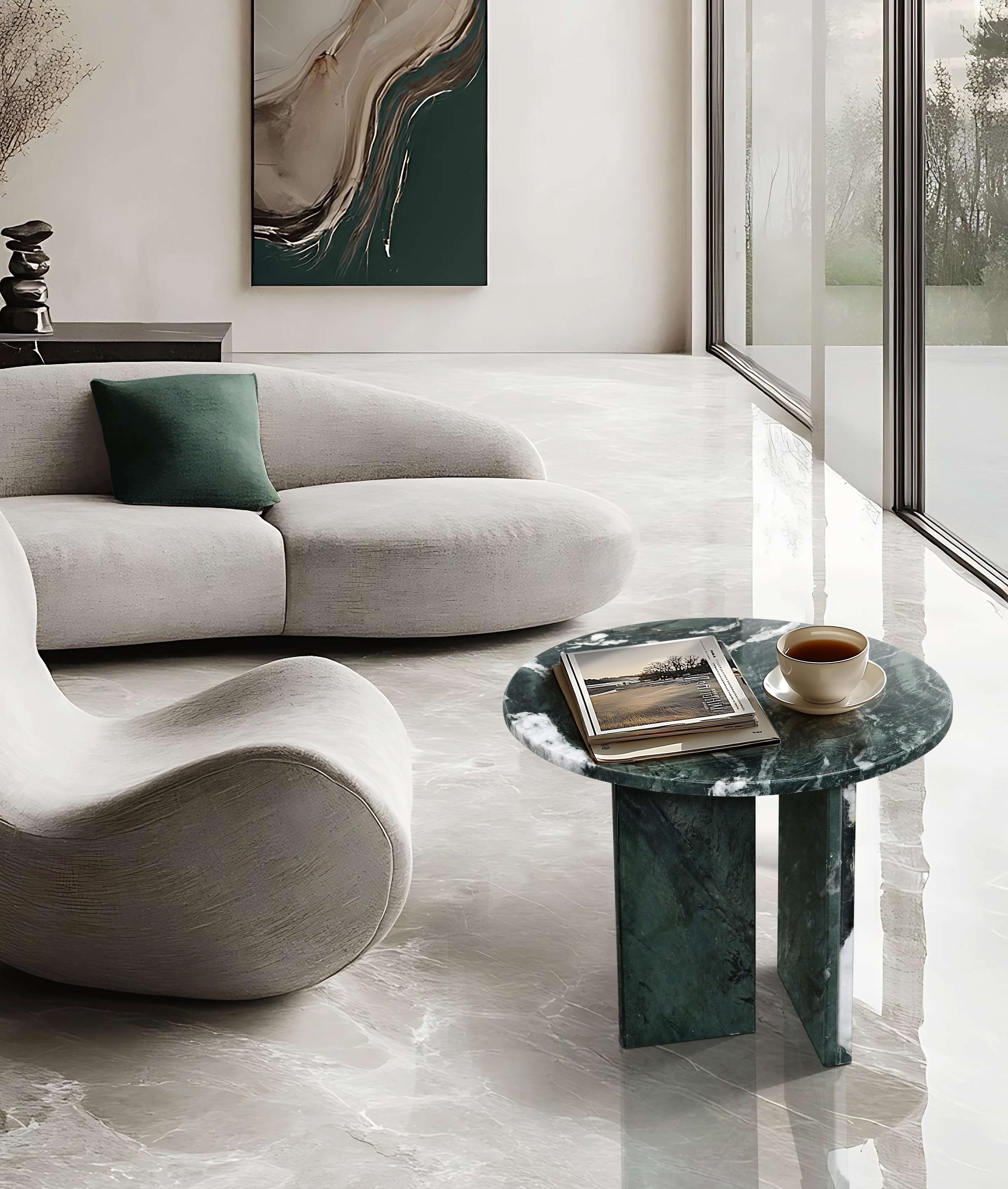Luxury marble coffee table placed in a spacious minimalist interior, complementing high-end furniture and marble flooring.