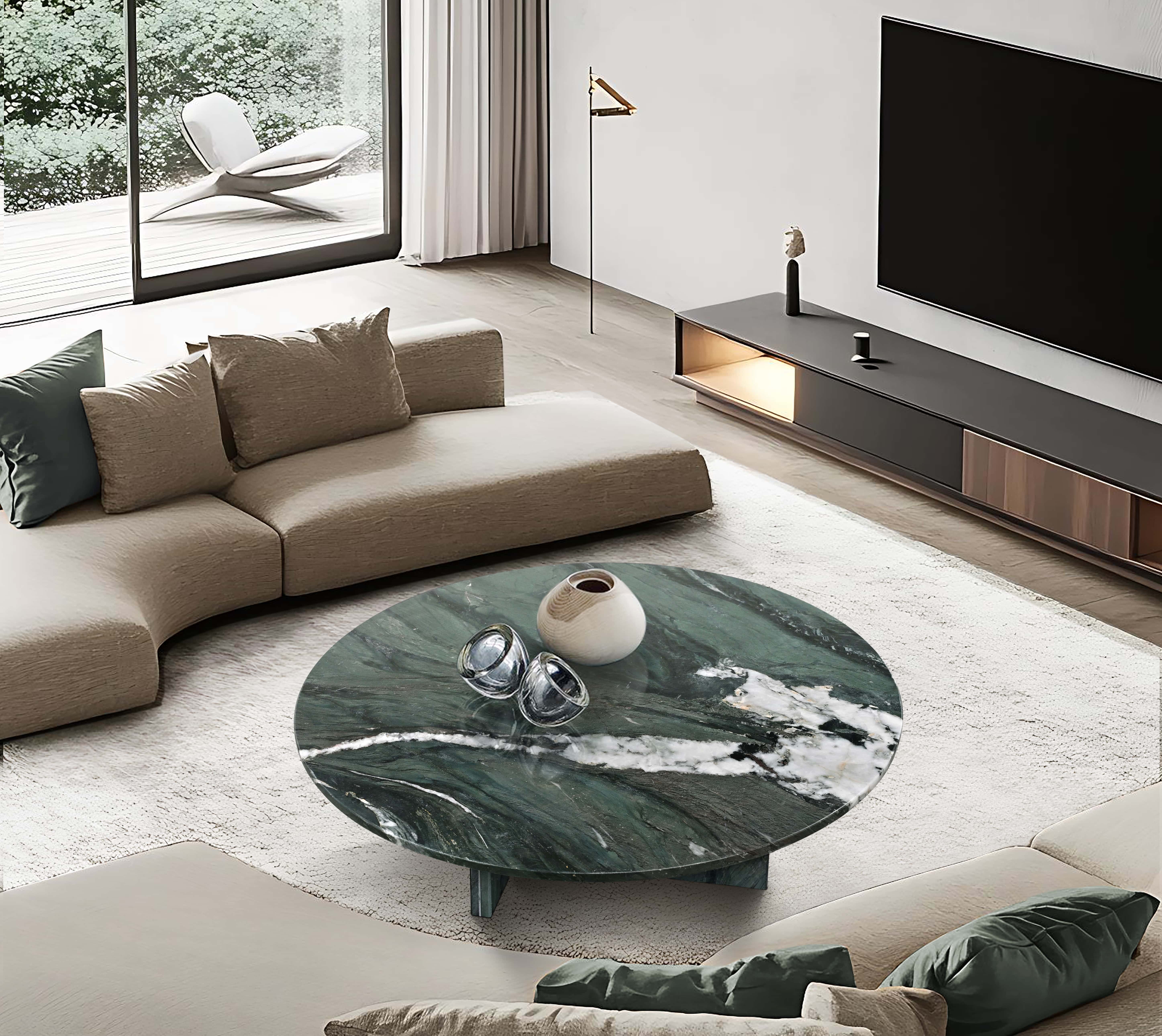 A contemporary interior design example using the green marble table as a sophisticated living room centerpiece.