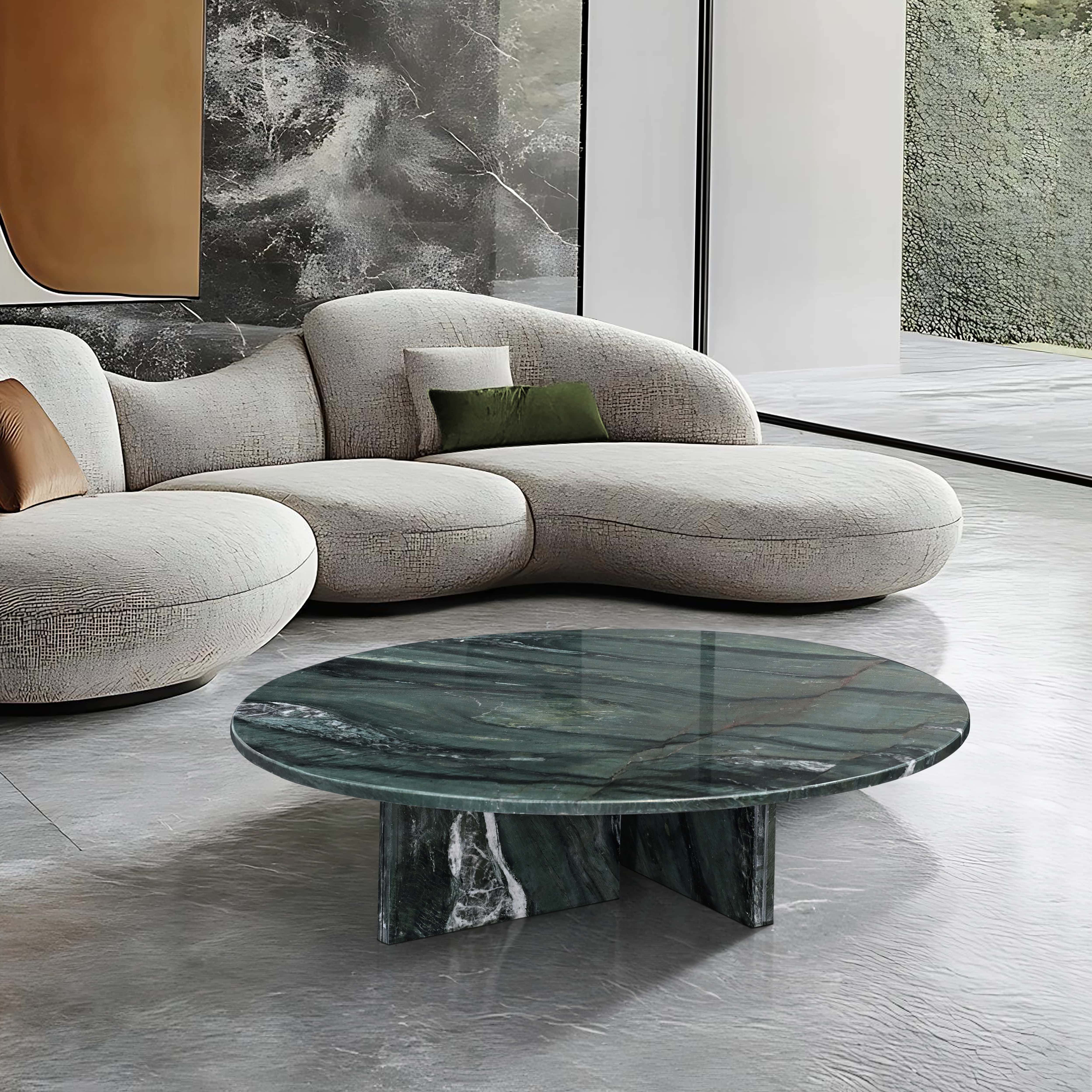 Luxury living room styling featuring a green stone coffee table that complements warm lighting and soft textures.