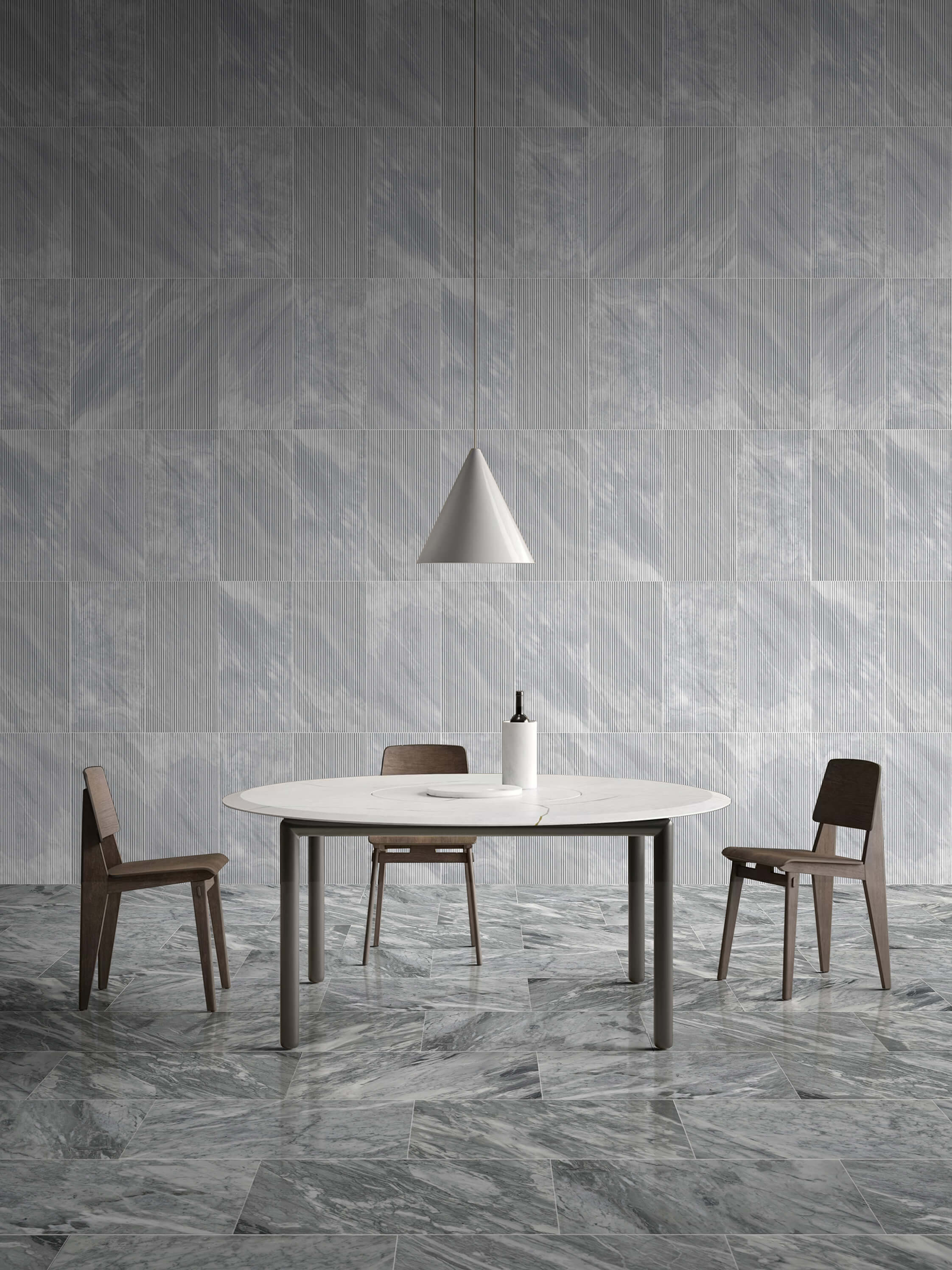 Elegant dining room design featuring 12x24 Carrara Gray polished marble floor tiles paired with OL textured finished wall tiles. 100% natural and unique stone.