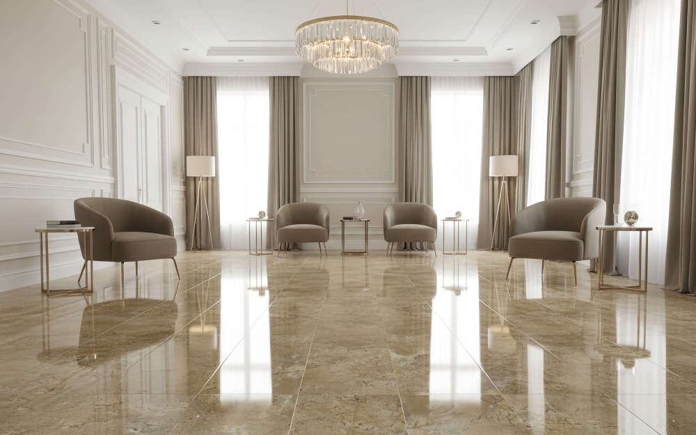 Elegant living space grounded by Hyatt Gold natural marble tiles, reflecting natural light to highlight the 100% exclusive, unique veining of each stone.
