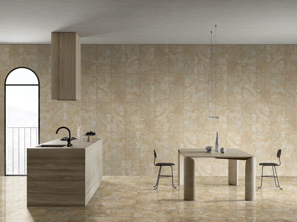 Elegant kitchen interior featuring contrasting textures of Hyatt Gold natural marble: polished tiles on the floor and FS finish on the walls, proving every piece is uniquely beautiful.
