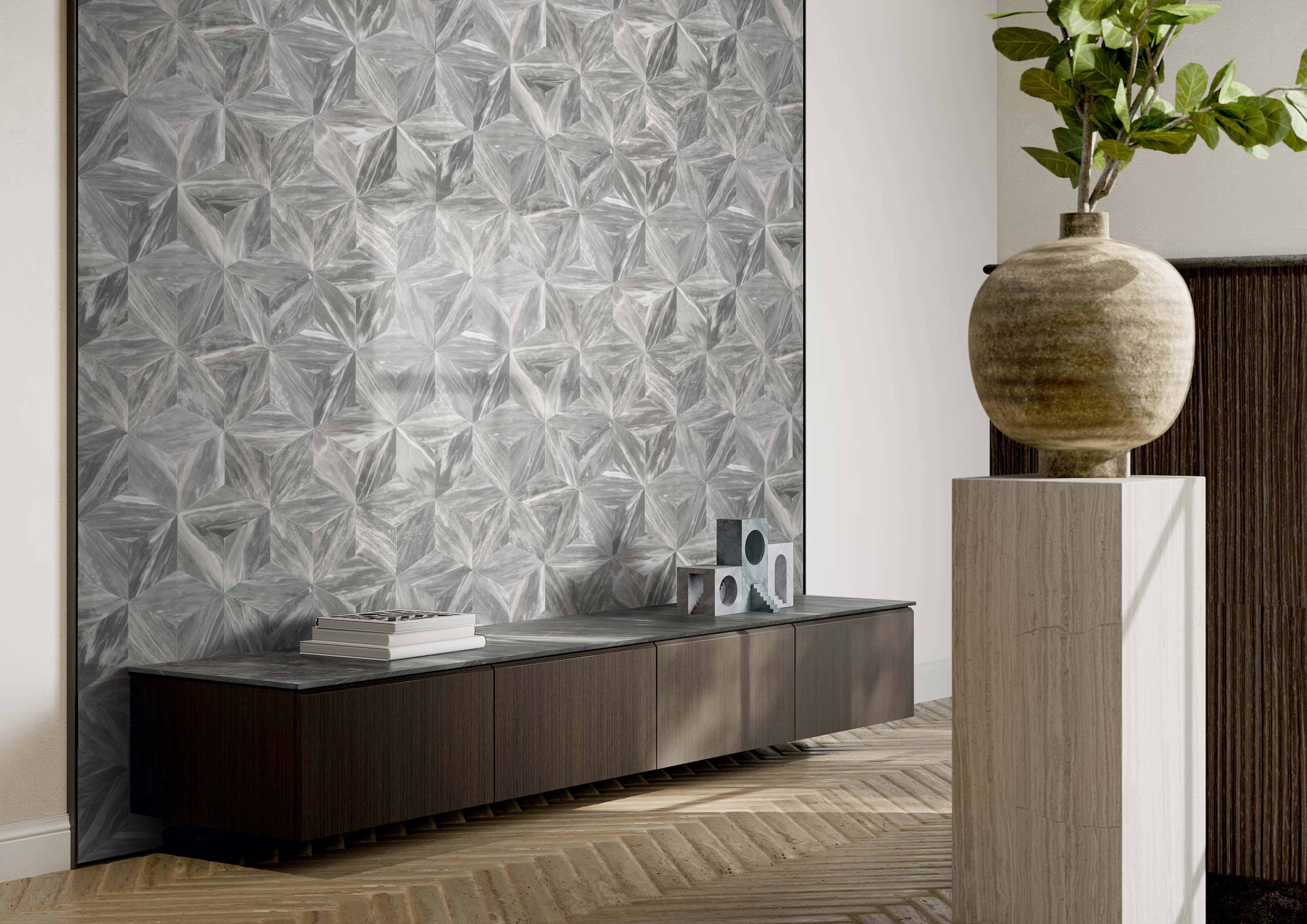 Minimalist interior showcasing a geometric Carrara gray marble feature wall, highlighting the unique 3D cube pattern and premium honed finish.