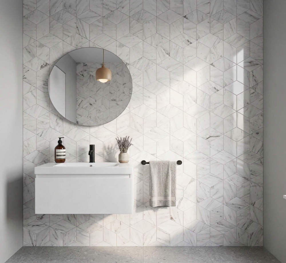 Minimalist modern bathroom interior featuring an entire wall of premium Snow Mountain White hexagon polished marble tiles.