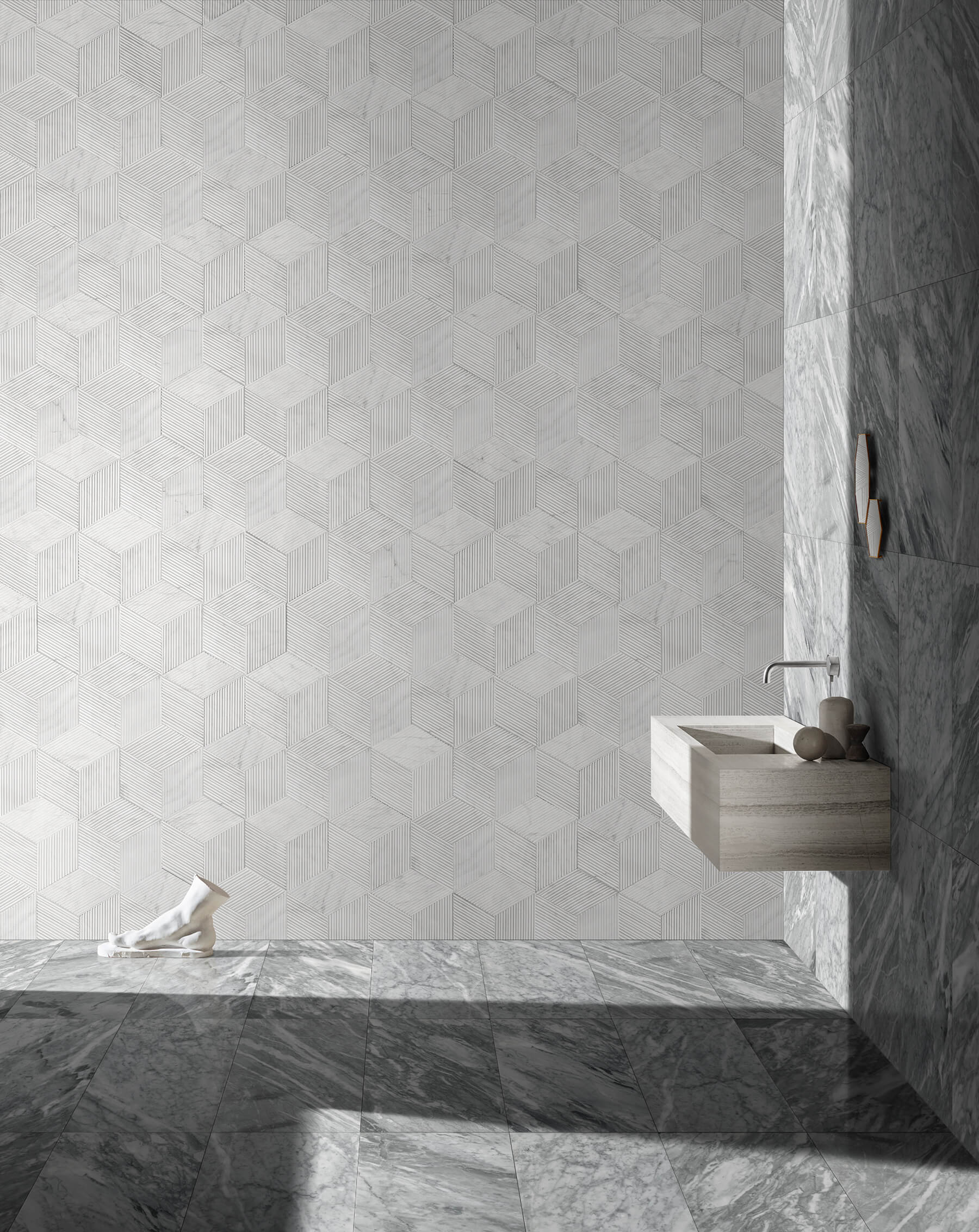 Stunning bathroom interior combining 12x24 Carrara Gray polished tiles with a 100% natural Snow Mountain White textured hexagon marble feature wall for rich visual interest.