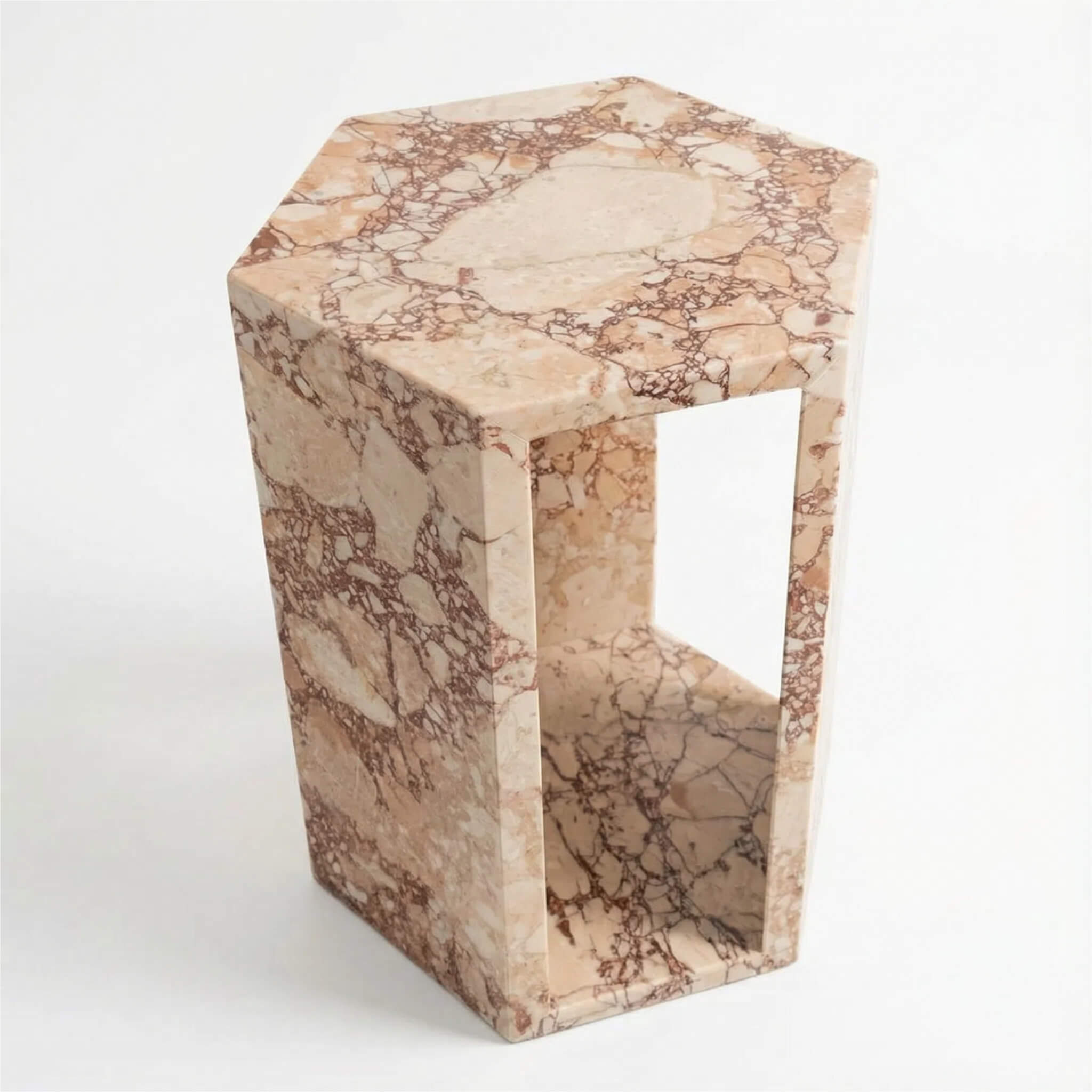 Angled view of the hexagonal solid marble end table, a perfect compact and modern accent stand for small living room spaces.