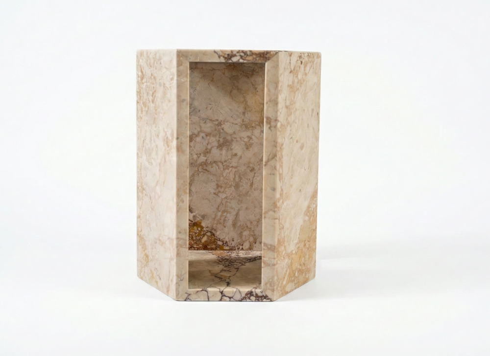 Front view of the luxury natural diamond pink marble hexagon side table featuring a unique hollow geometric center.