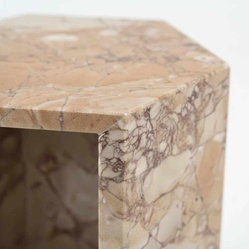 Close-up of the beautifully polished edges on the solid marble accent table, displaying the premium thickness and unique quality of the natural stone.